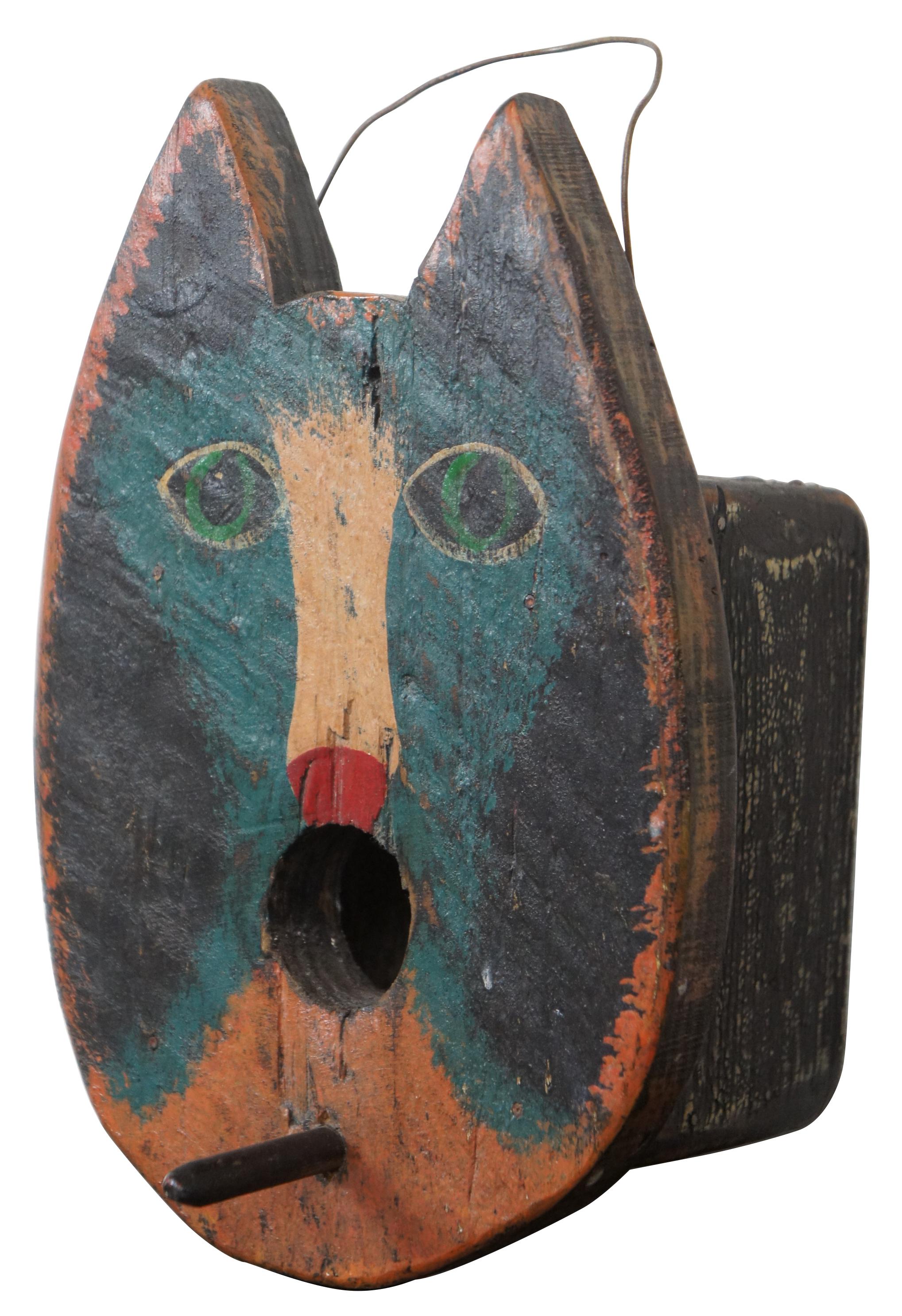 Handmade antique Folk Art painted wooden birdhouse shaped like a blue, white and black cat’s face. Measure: 7