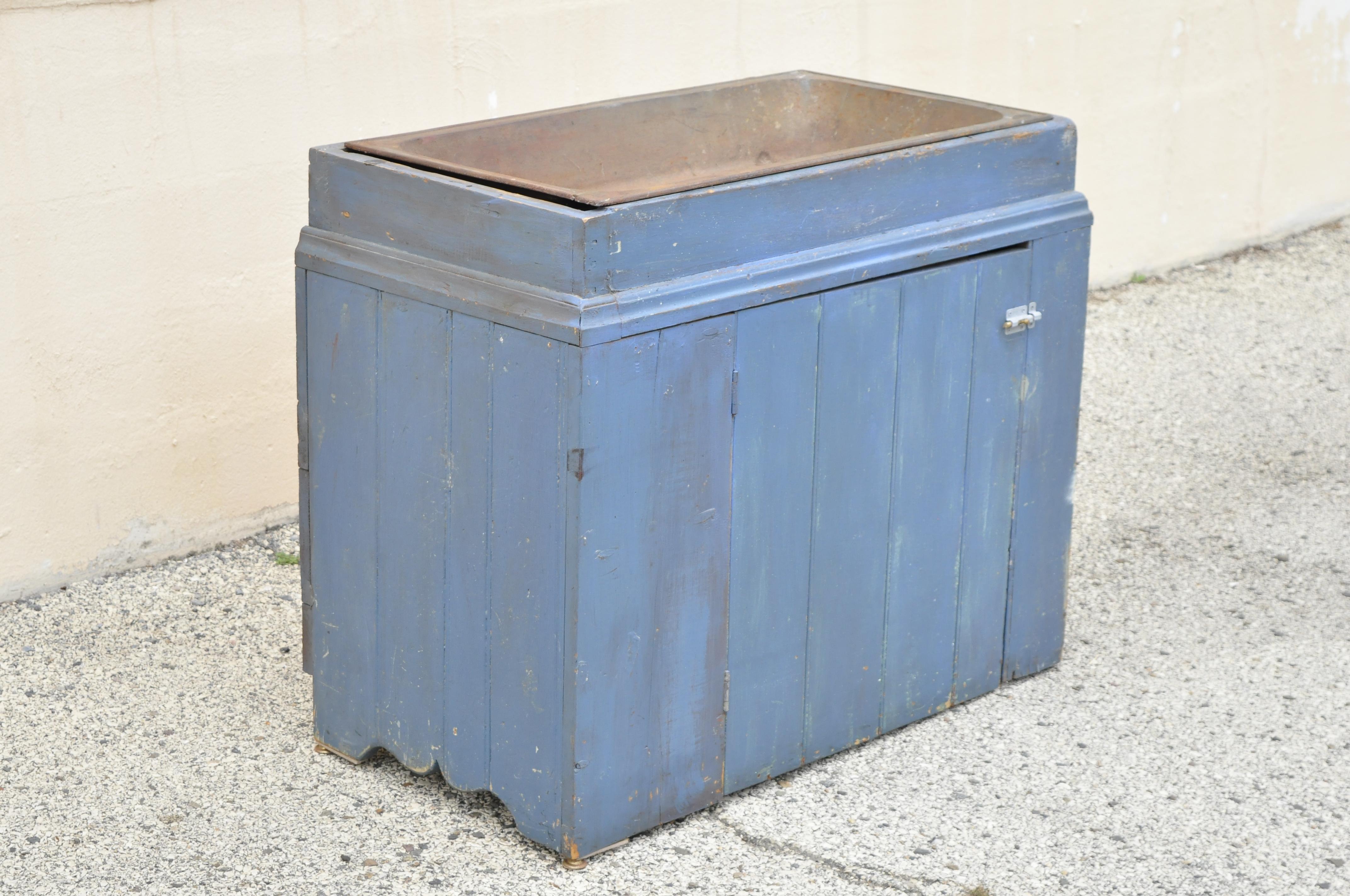 Antique blue distress painted cupboard cabinet vanity cast iron sink. Item features blue distress painted finish, green distress painted interior, cast iron basin sink top (removable), wrought iron construction, quality craftsmanship, great style