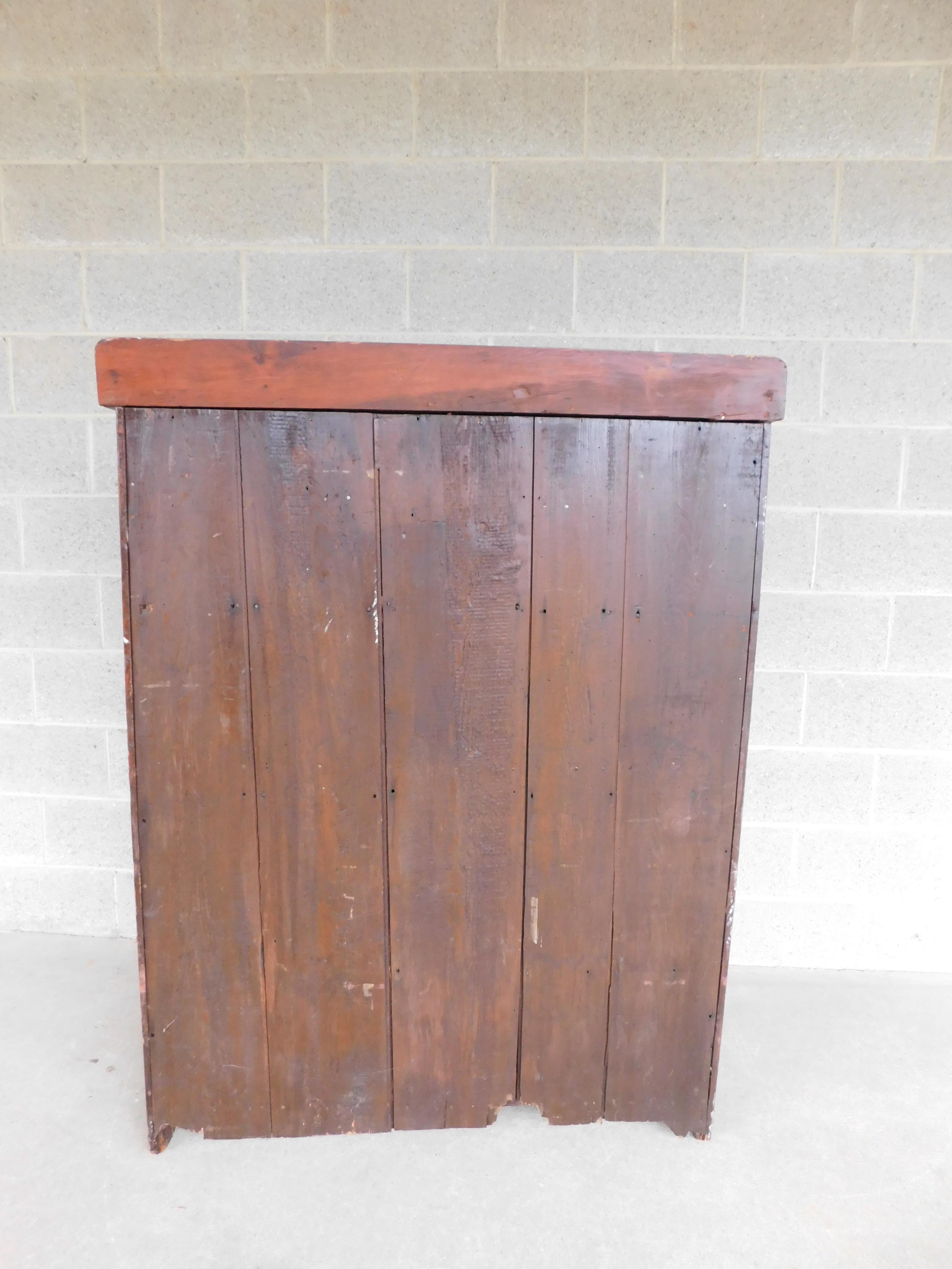Antique Primitive Cherry Dry Sink

Circa Mid 19th Century, Cherry Wood with 3 Storage Drawers across the Top below with a Mid Level Shelf, and Dry Sink area. Lower Storage behind the Doors, with one Fixed Shelf.

Good Antique Sturdy