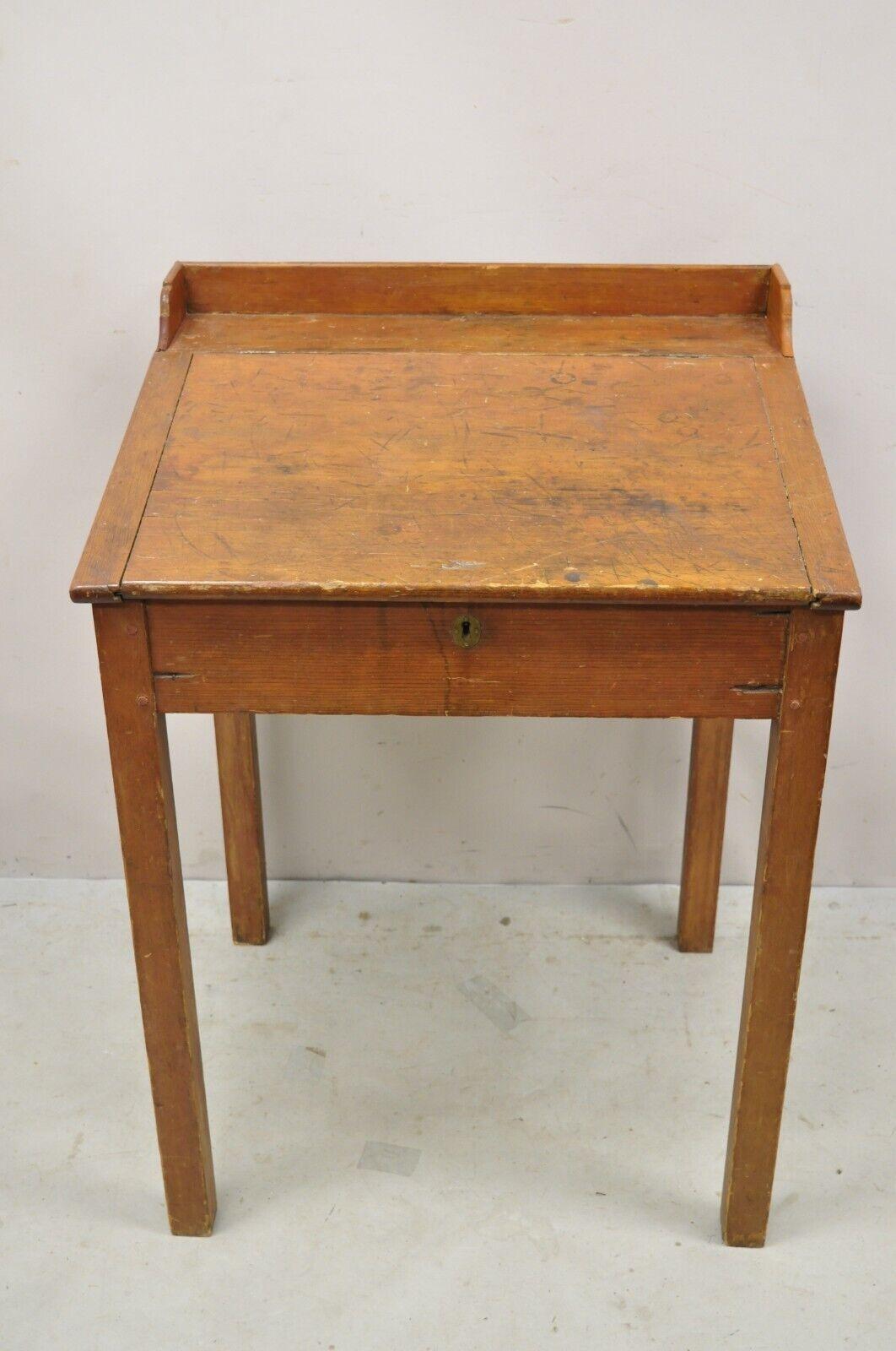 Antique Primitive Colonial Cherry Walnut Tall Schoolmasters Desk Work Stand Table. Item featured Lift top, slanted surface, tall legs, solid wood construction, distressed finish, no key, but unlocked, very nice antique item, quality American