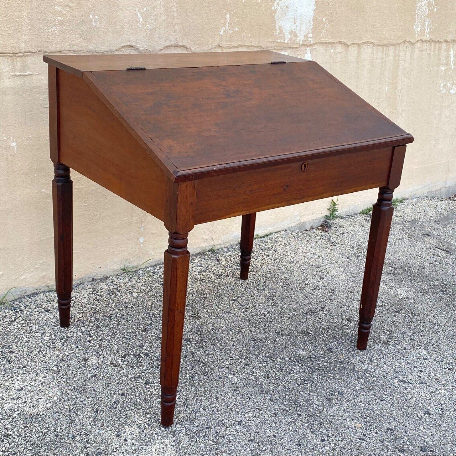 Antique Primitive Colonial Cherry Walnut Tall Schoolmasters Desk Stand Table. Item featured has a lift top, slanted surface, tall legs, solid wood construction, distressed finish, no key, but unlocked, very nice antique item, quality American