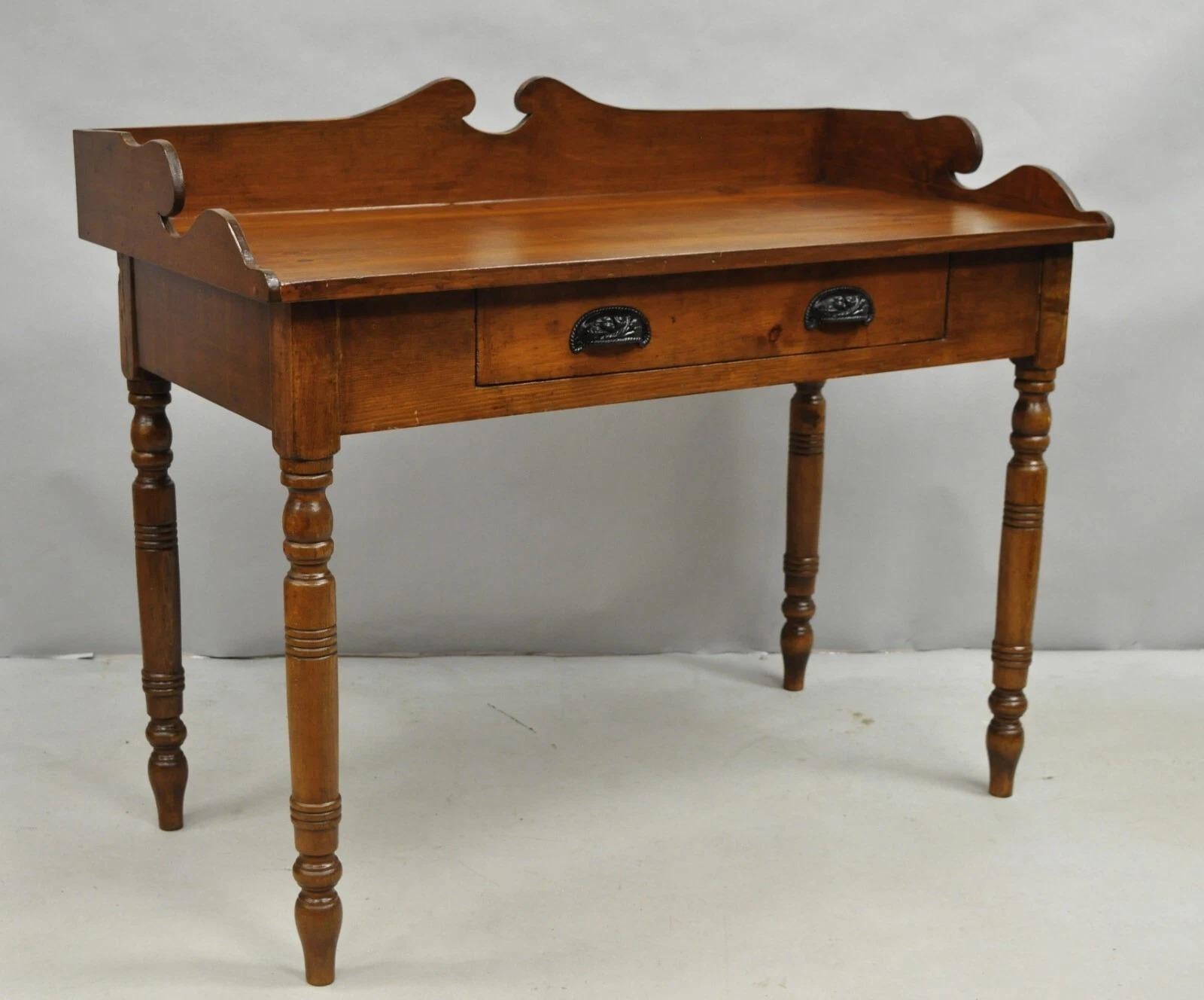 Please message us with your zip code to request a more reasonable domestic U.S. shipping quote.

Antique Primitive Colonial Pine Wood 1 Drawer Work Table Desk w/ Backsplash. Circa Late 19th Century. Measurements: 36
