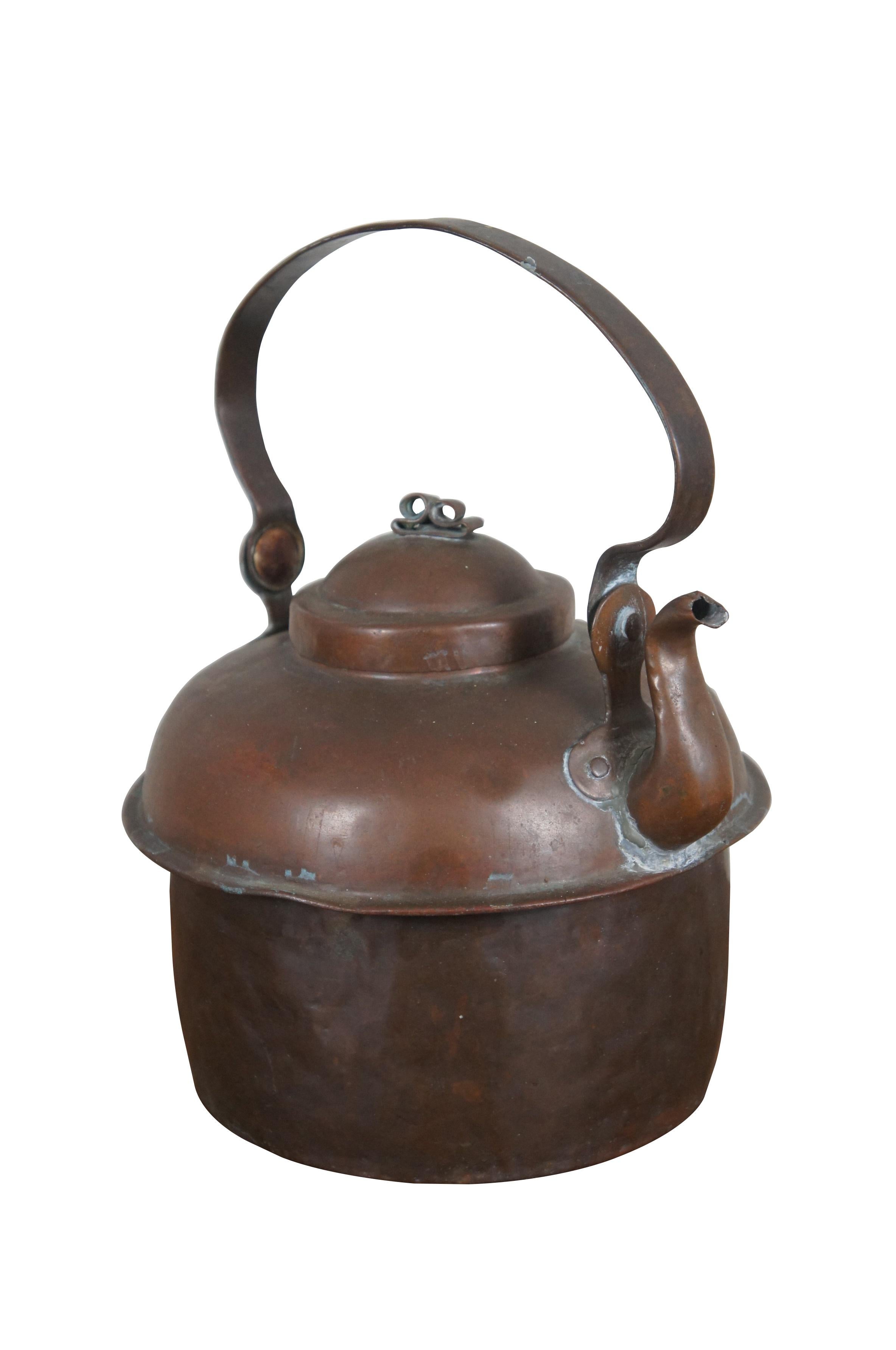 Large 19th century dovetailed copper farmhouse kettle / coffee pot with gooseneck shaped spout, rotating bail handle and scrolled finial on the lid.

Dimensions:
9.75