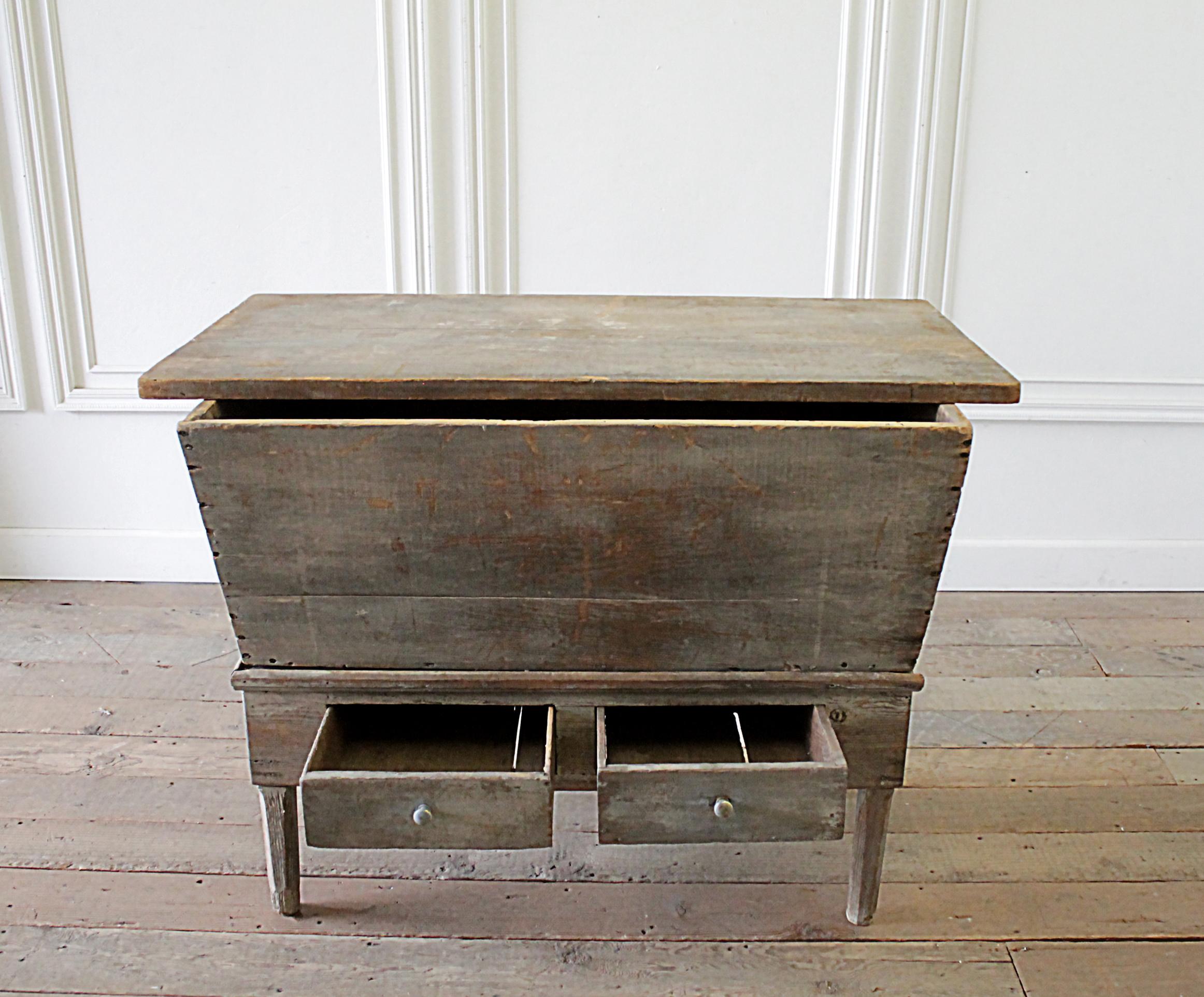 Antique primitive country dough bin server table
Beautiful patina in a grey-blue color rubbed away to show natural wood tones. Original painted patina. This was a storage to house bread, bread doughs. The top is not attached, it does come off the