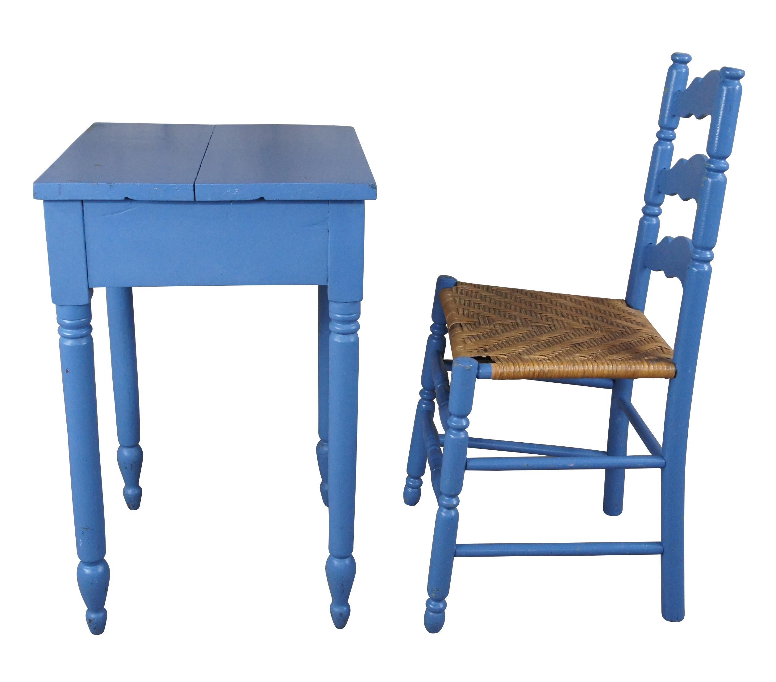 20th century Primitive table and Shaker chair. Made from hardwood with a blue painted finish. The table features turned legs and arrow feet. The chair has a ladder back and rush seat.

Table - 20.75