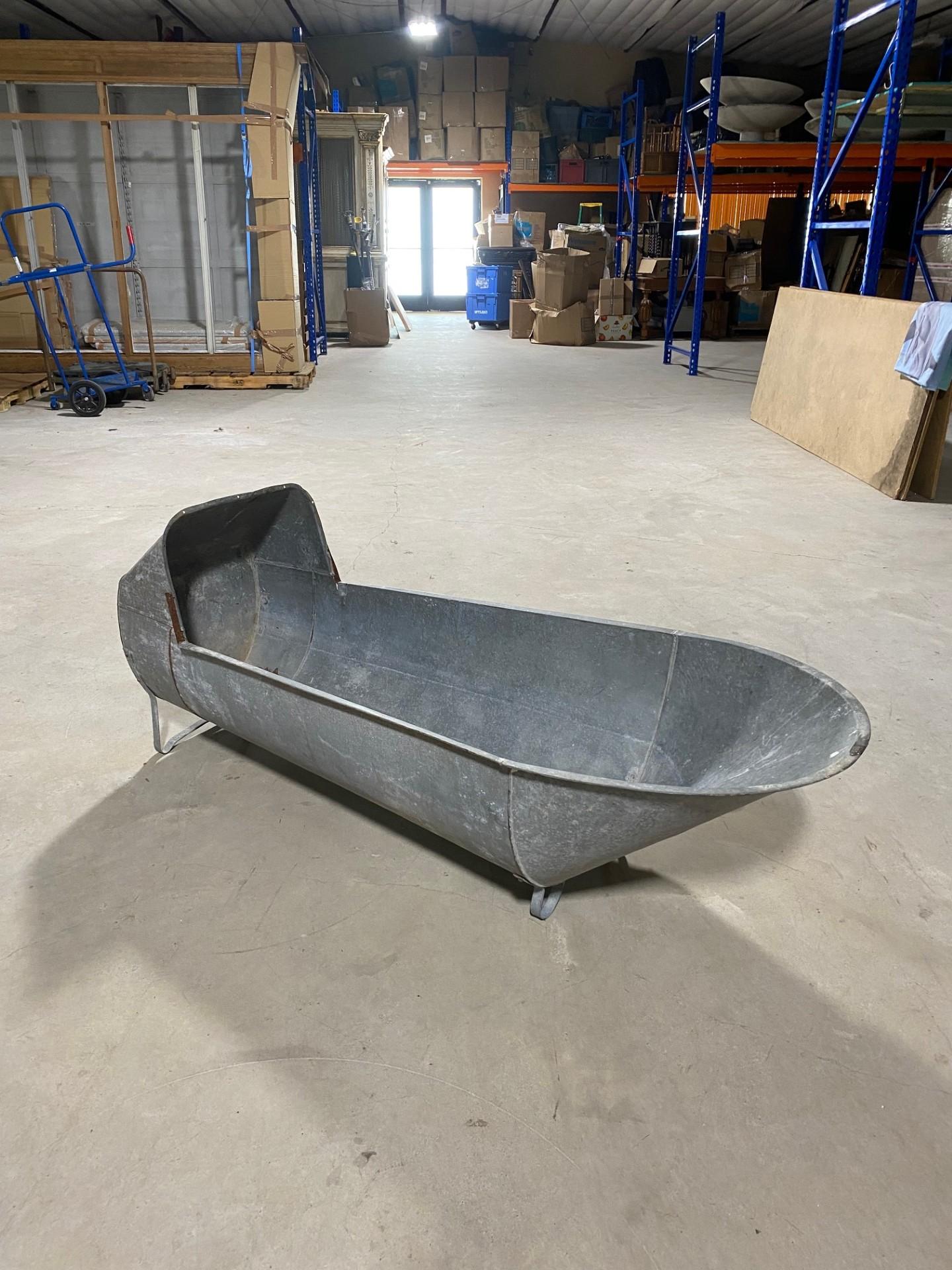 This antique galvanized metal tin cowboy bathtub, often referred to as a sit-down or hip tub, is a fascinating and rare item from the late 19th to early 20th century. Here’s a more detailed description and analysis:

Description
Type: Antique