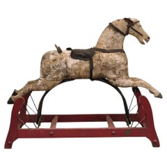 Ancien cheval à bascule primitif rocking hobby rustique en bois sculpté et fonte rouge