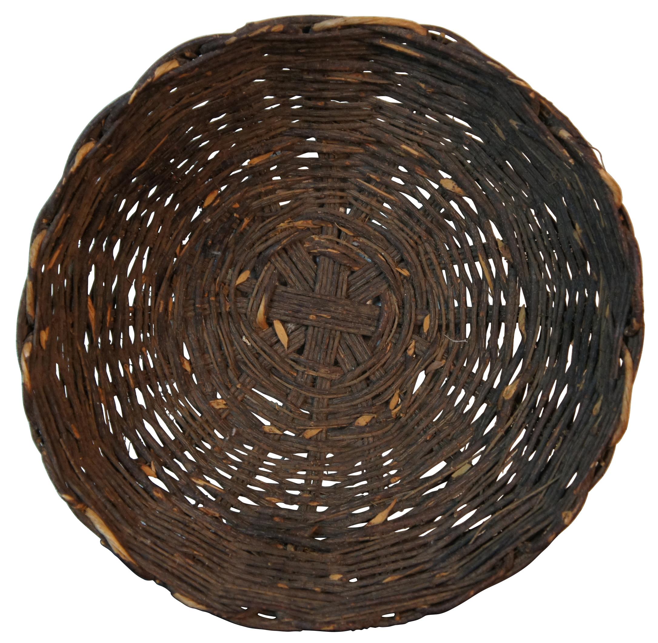Antique hand woven willow basket with no handles and a gently scalloped top edge. Measure: 16