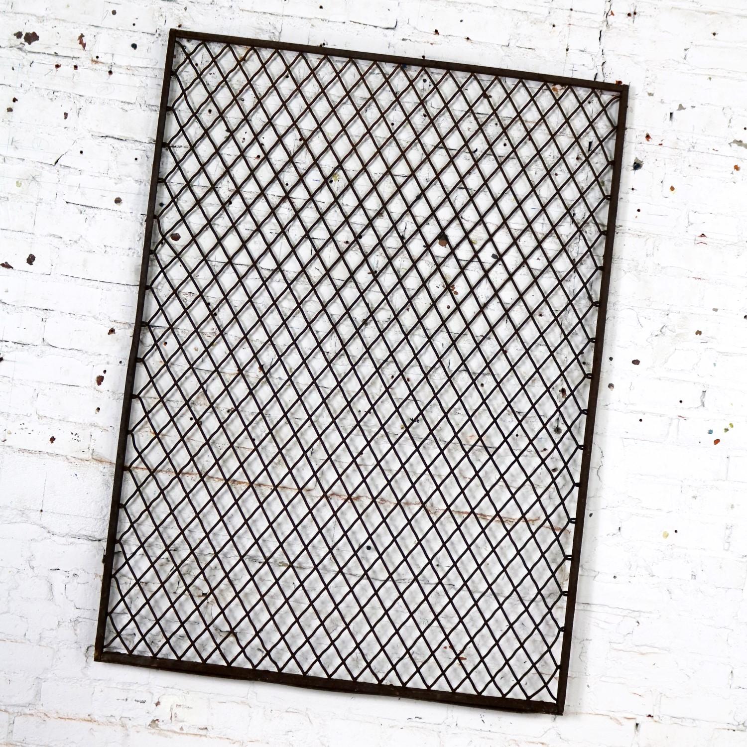 Interesting antique primitive and rustic woven wire industrial window security guard or grate. It is wonderful condition with lots of rusty age patina. Please see photos, circa 1920s-1950s.

This rustic industrial window grate will look fantastic in
