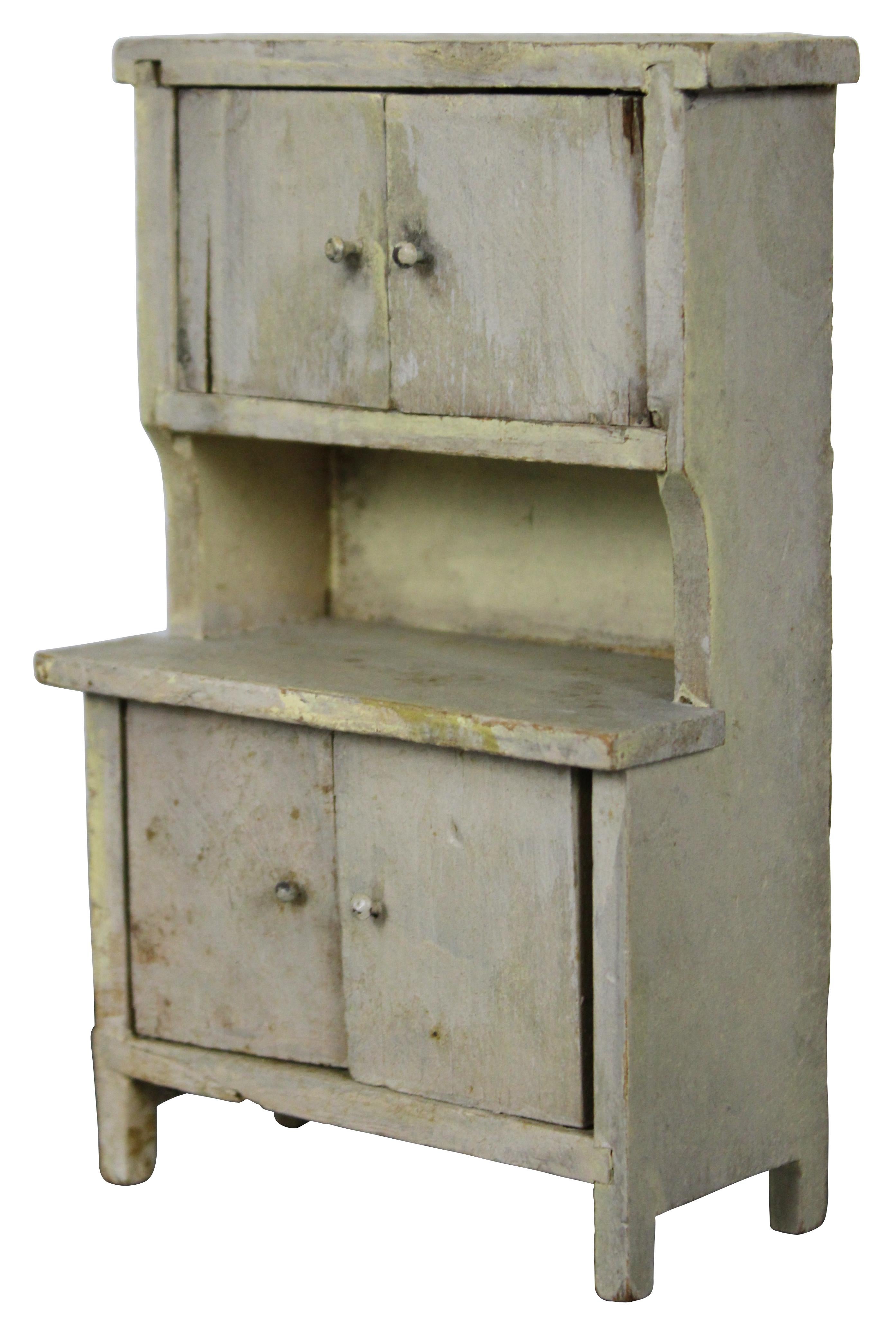 Antique early 20th century distressed white painted miniature dollhouse sized cupboard. Measure: 6