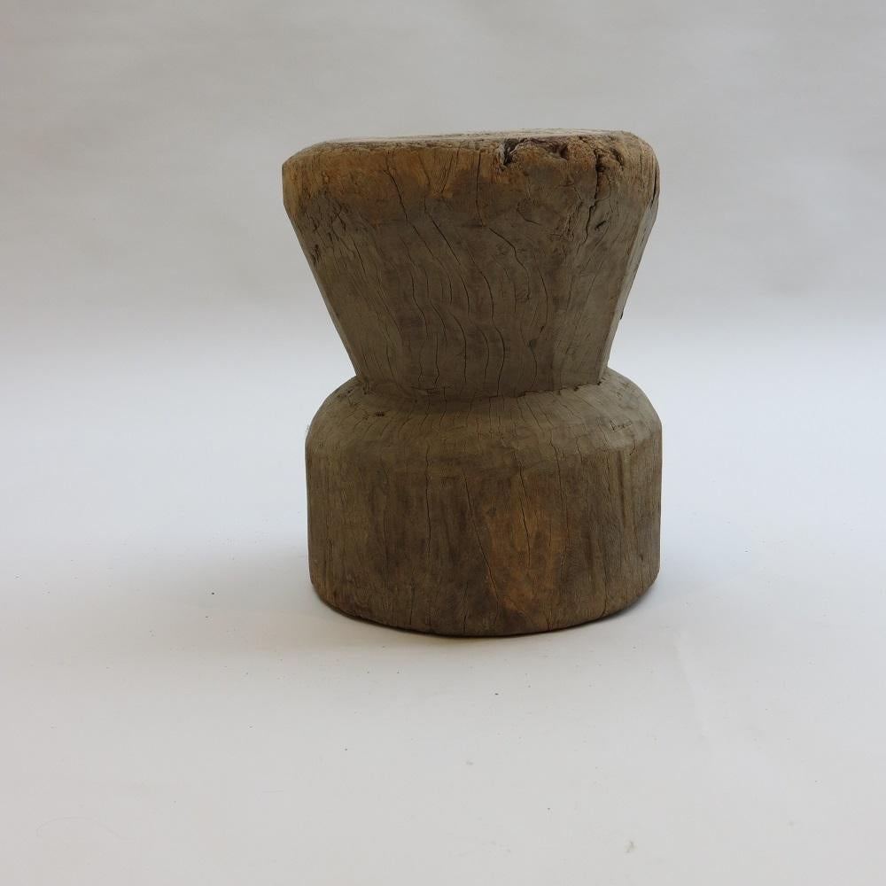 A wonderful primitive rustic wooden mortar.
Made from hardwood, this piece has been hand crafted.
The piece is very versatile and can be used as a stool, small side table or turned over to be used as a plant holder mortar. 
In wonderful original