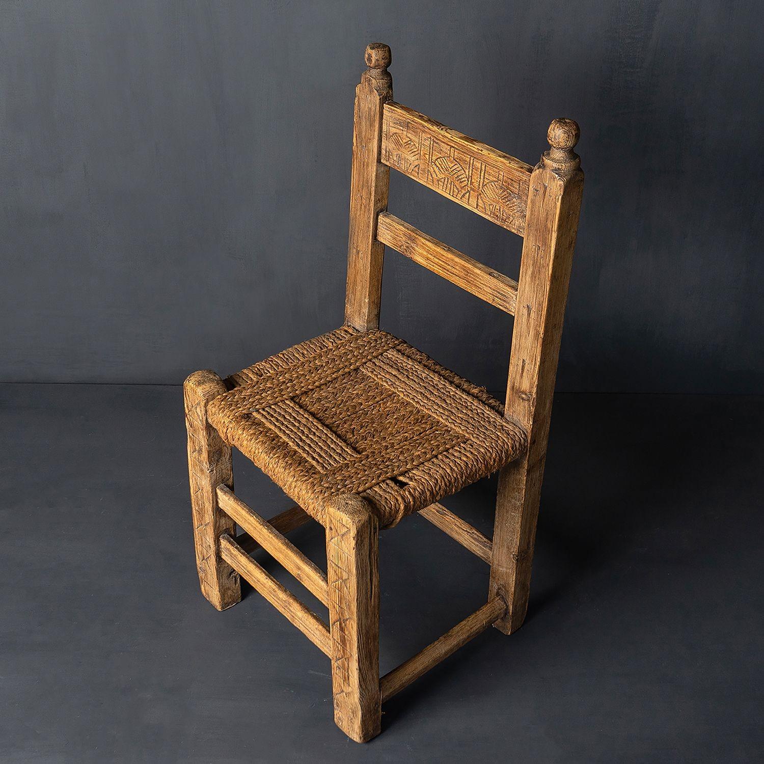 ANTIQUE FARMHOUSE CHAIR
Chip-carved wooden frame with woven rush seat.
It is in very good vintage condition, the joints all seem good as does the seat. There is some cosmetic wear commensurate with age which we think adds to its chairs and tells its