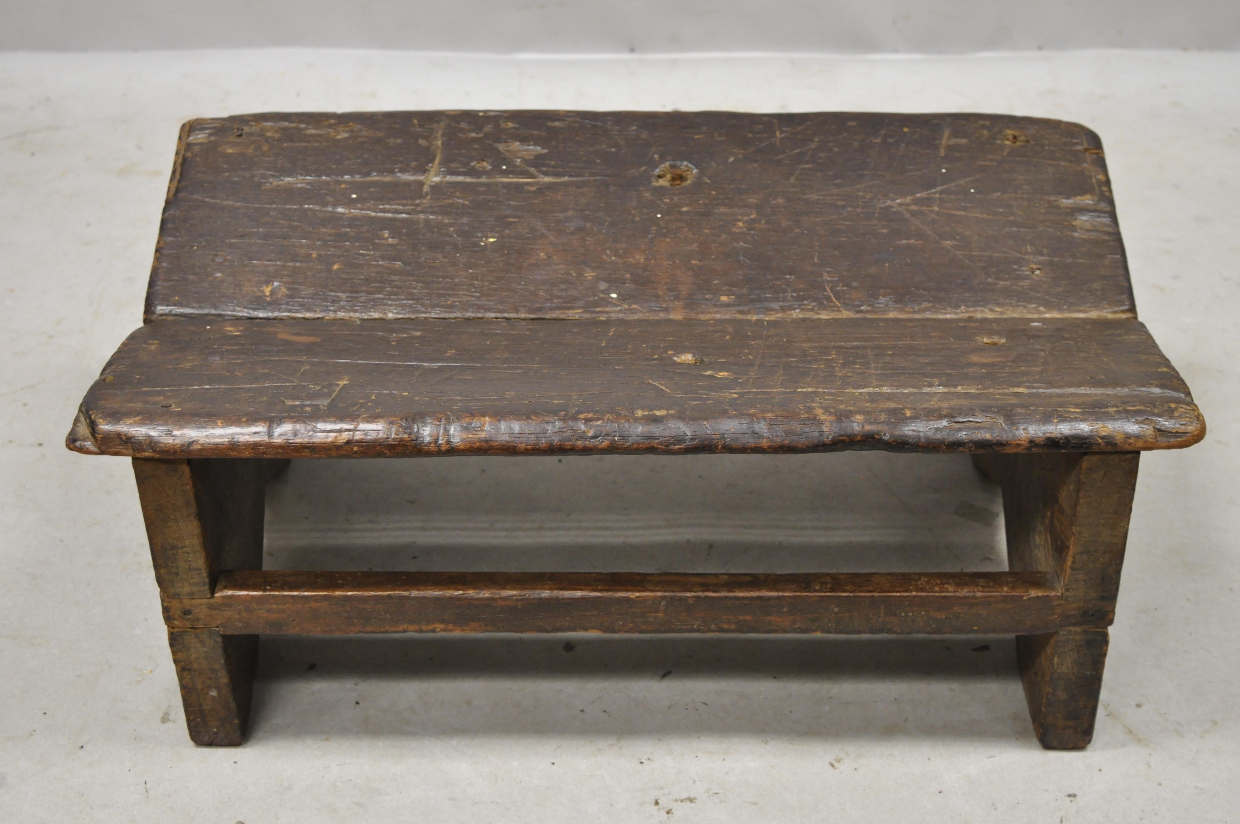 Antique Primitive Rustic French Country solid plank wood footstool stool ottoman. Item features dovetailed joinery, solid thick plank wood construction, beautiful wood grain, distressed finish, nicely carved details, very nice antique item, great