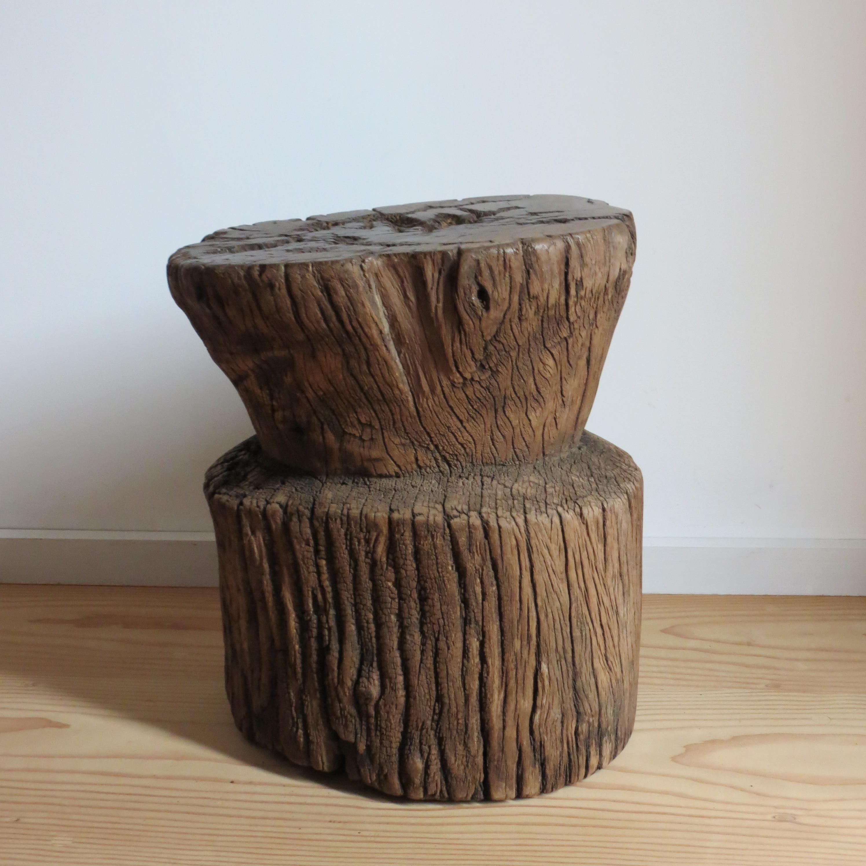 A wonderful primitive rustic wooden mortar stool or table. 
Made from hardwood, this piece has been hand crafted.
The piece is very versatile and can be used as a small table or stool or turned up the other way and used as a plant holder or as a