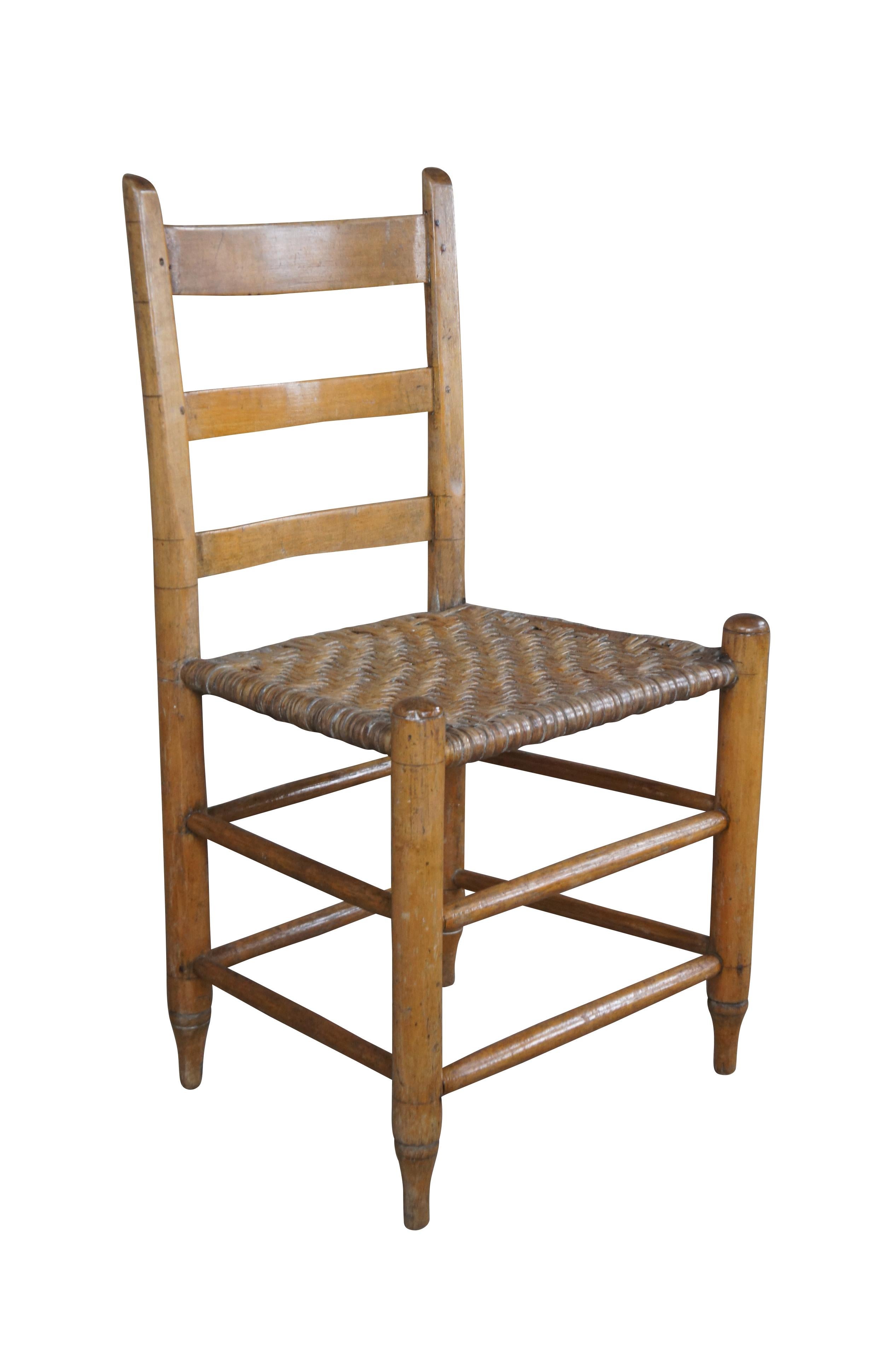 Antique Primitive Shaker farmhouse chair. Made of maple featuring thumb back and ladderback with woven rush seat and tapered feet.

Dimensions: 
18.5