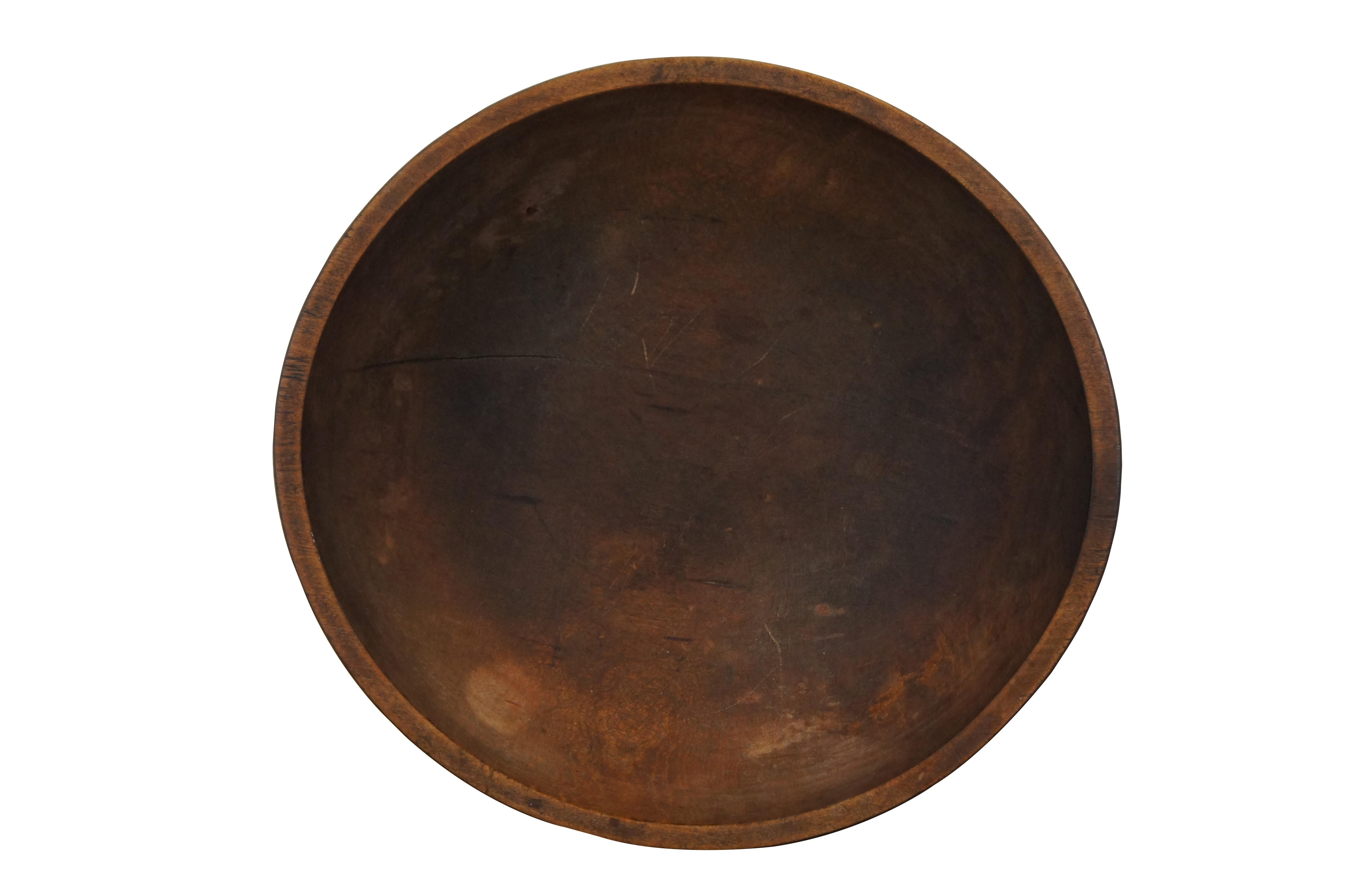 Large antique folk art country farmhouse dough mixing or centerpiece fruit bowl.  Made of turned maple wood featuring round form with banded lip.  

Dimensions:
17.5” x 16.5” x 5” (Width x Depth x Height)