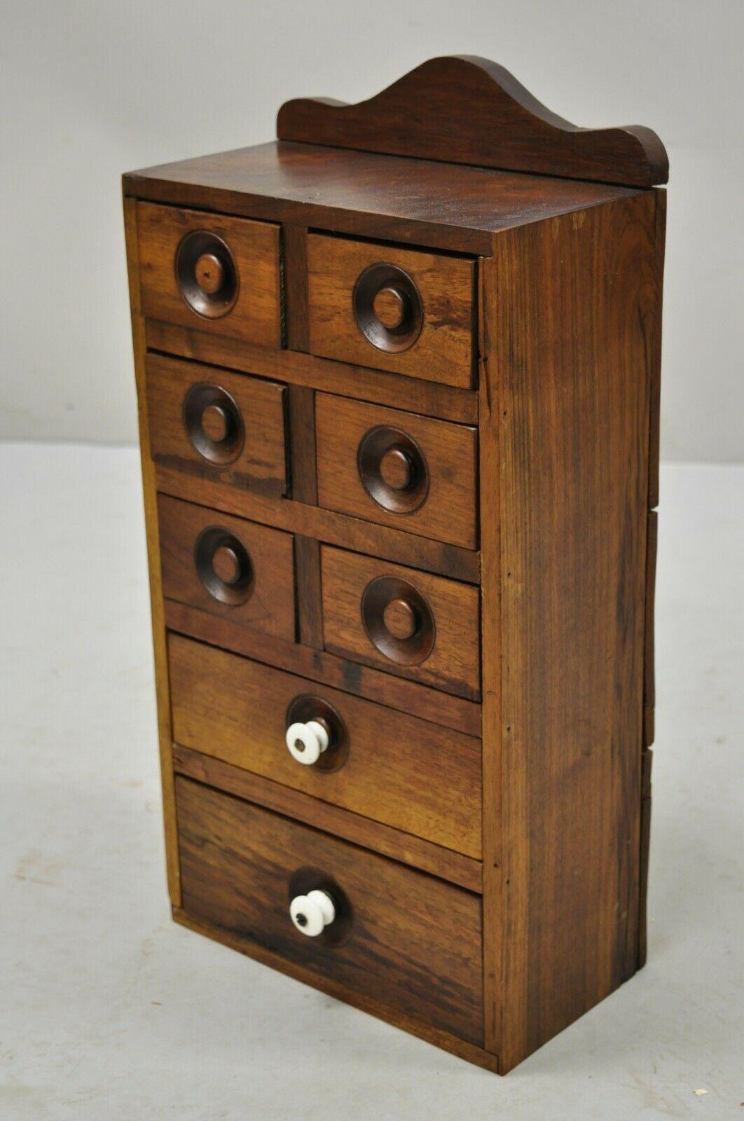 Antique Primitive walnut Spice cabinet small Apothecary chest 8 drawers. Item features beautiful wood grain, solid wood construction, distressed finish, nicely carved, 8 drawers, very nice antique item, quality American craftsmanship, great style