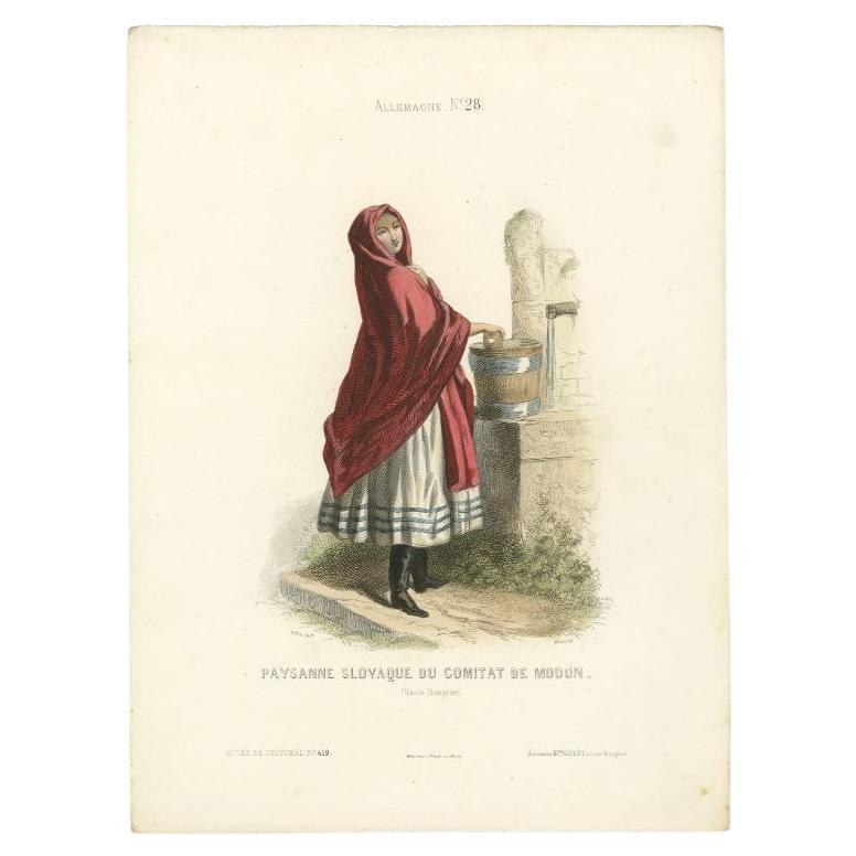 Antique costume print titled 'Paysanne Slovaque du Comitat de Modon'. Old print depicting a Slovak peasant girl from Modon. This print originates from 'Costumes Moderne (Musée de Costumes). 

Artists and Engravers: Published in Paris: Ancienne
