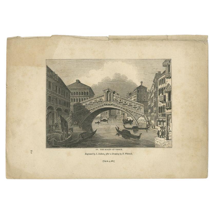 Antique print titled 'The Rialto at Venice'. Old print of the Rialto Bridge (or Ponte di Rialto) in Venice, Italy. This print originates from 'One Hundred and Fifty Wood Cuts selected from the Penny Magazine'. 

Artists and Engravers: Published by