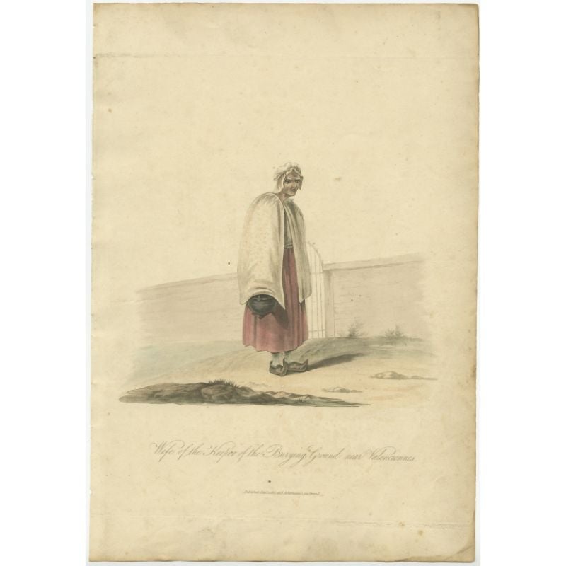 Antique costume print titled 'Wife of the Keeper'. Old costume print depicting the wife of the keeper of the burying ground near Valenciennes. This print originates from 'The Costume of the Netherlands displayed in thirty coloured engravings'.