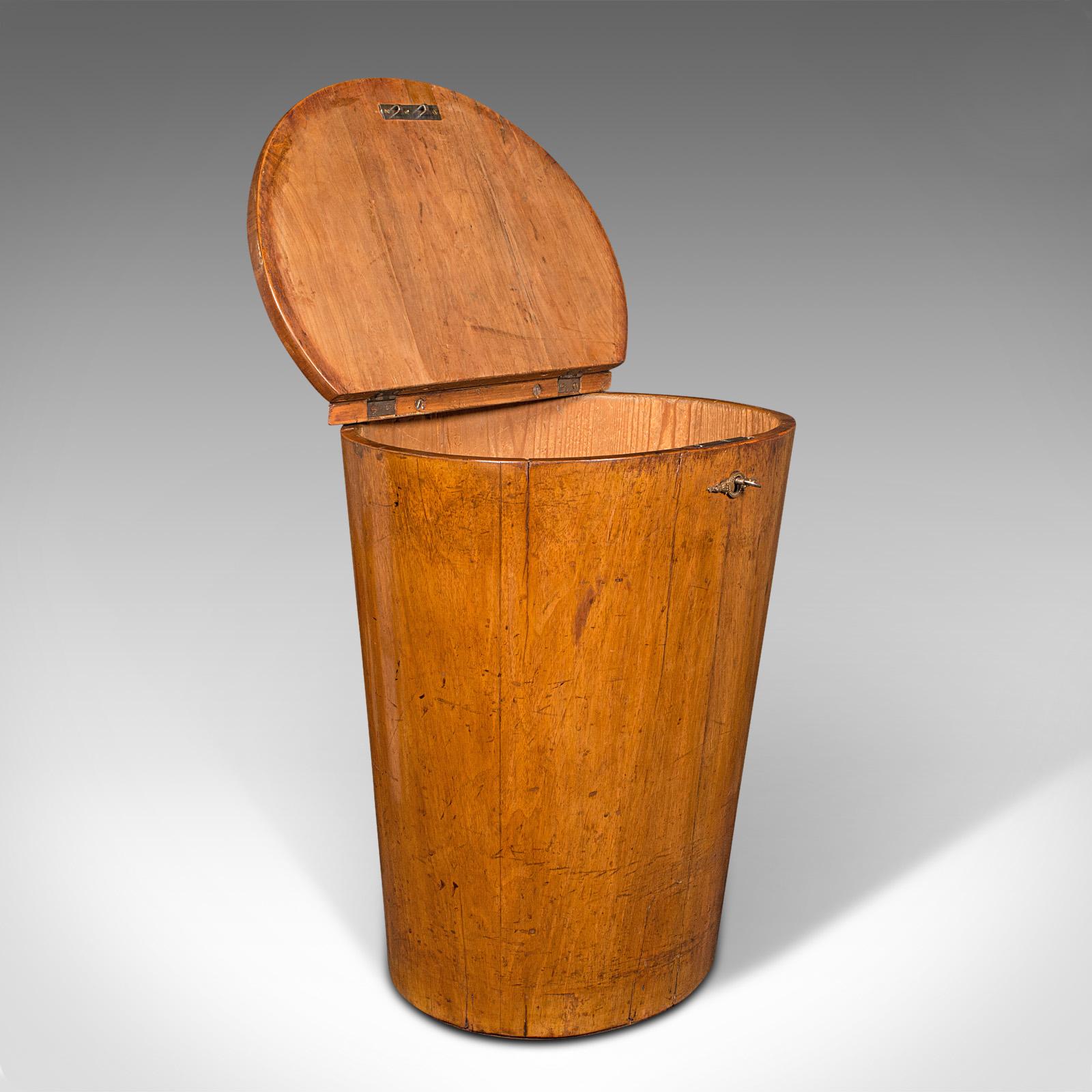This is an antique Provençal grain hopper. A French, fruitwood country house storage bin, linen basket or occasional chair, dating to the early Victorian period, circa 1850.

Distinctive tapering oval form with delightful craftsmanship
Displays a