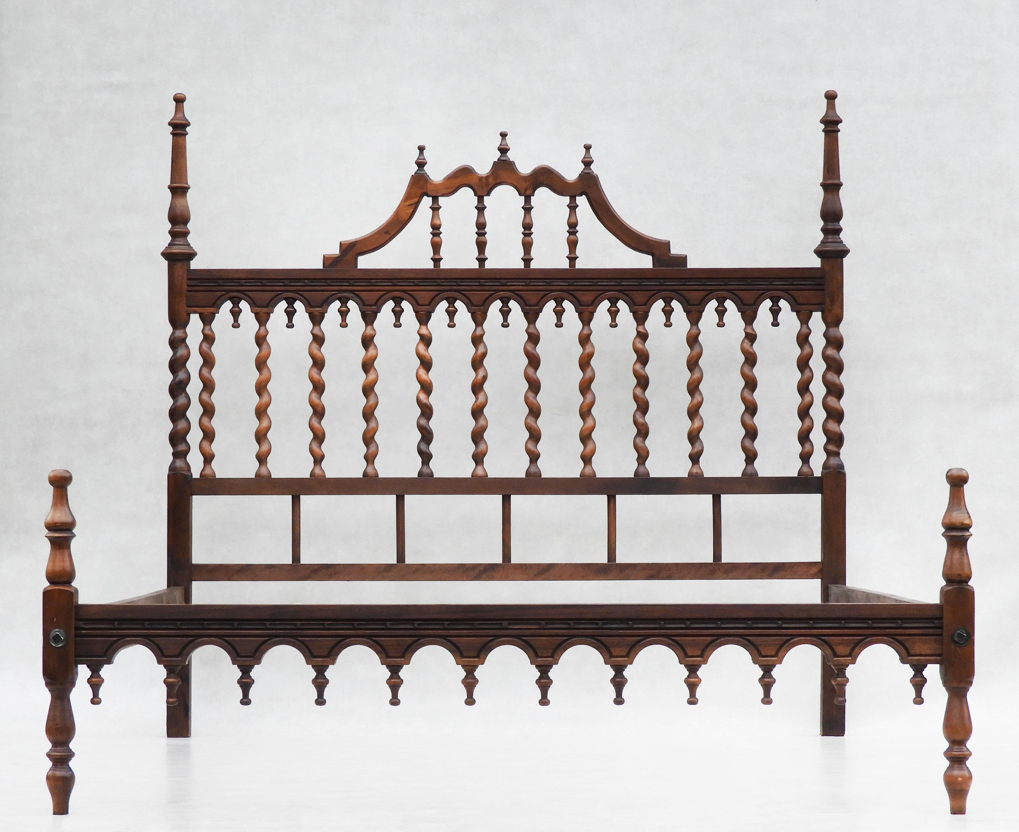 Antique Provincial Spanish bed spindle turned wood, Circa 1920

Gorgeous early 20th-century Spanish provincial bed.
Classic Iberian style, Artisan crafted bed with beautiful barley twist, finial and hand-carved detailing
In very good condition, nice