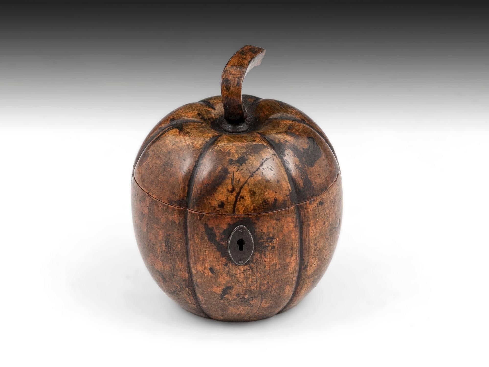 Extremely rare pumpkin / squash six segmented tea caddy in a mellow green and orange mottled colour. Fabulous patination, with a few life scars adding to its character and having its distinguishable shaped squared stalk and oval cut steel