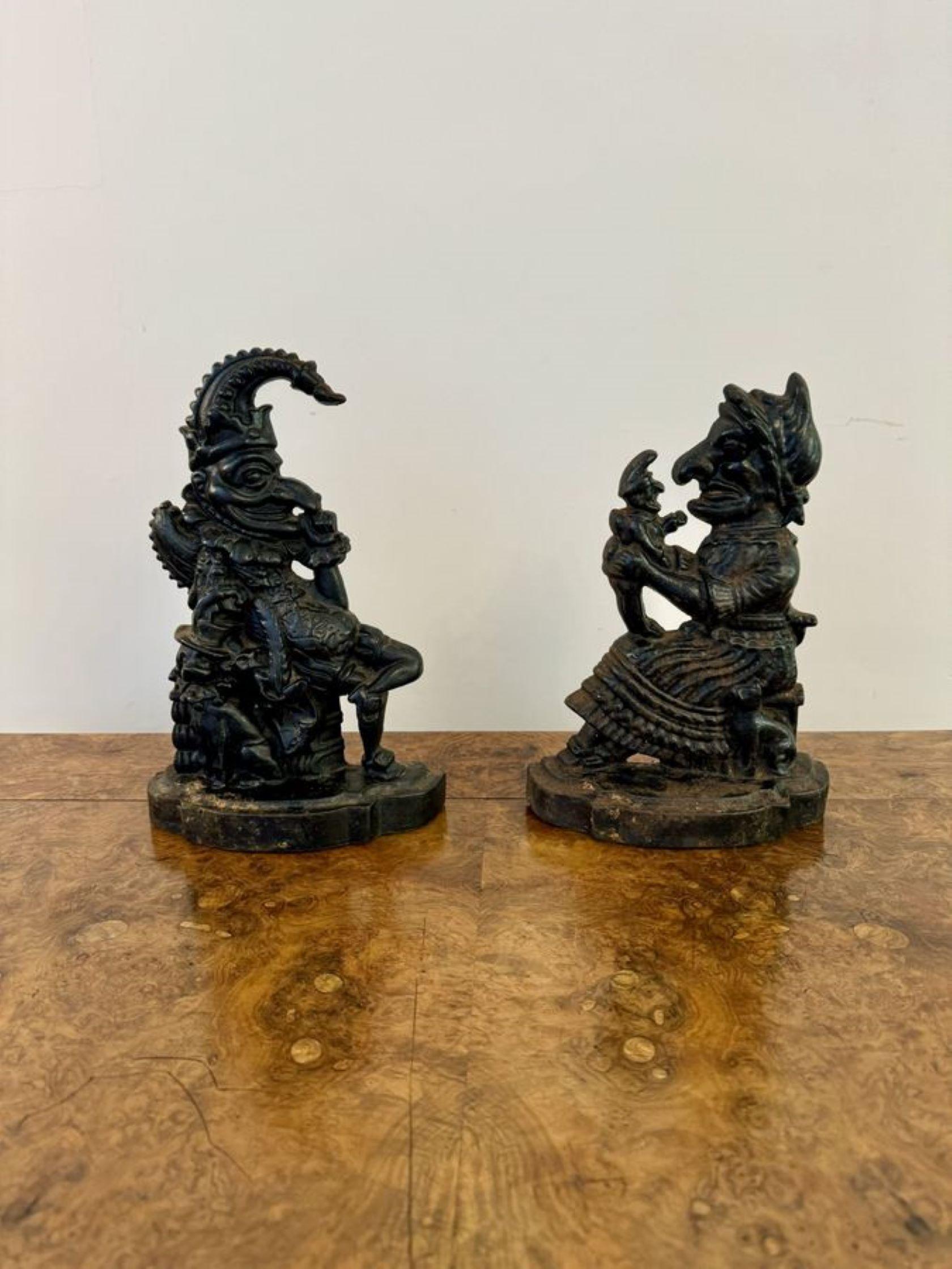 Antique Punch and Judy cast iron door stops, having Mr Punch with his dog called Toby by his side and Judy holding The Babe, raised on shaped bases.

D. 1910
