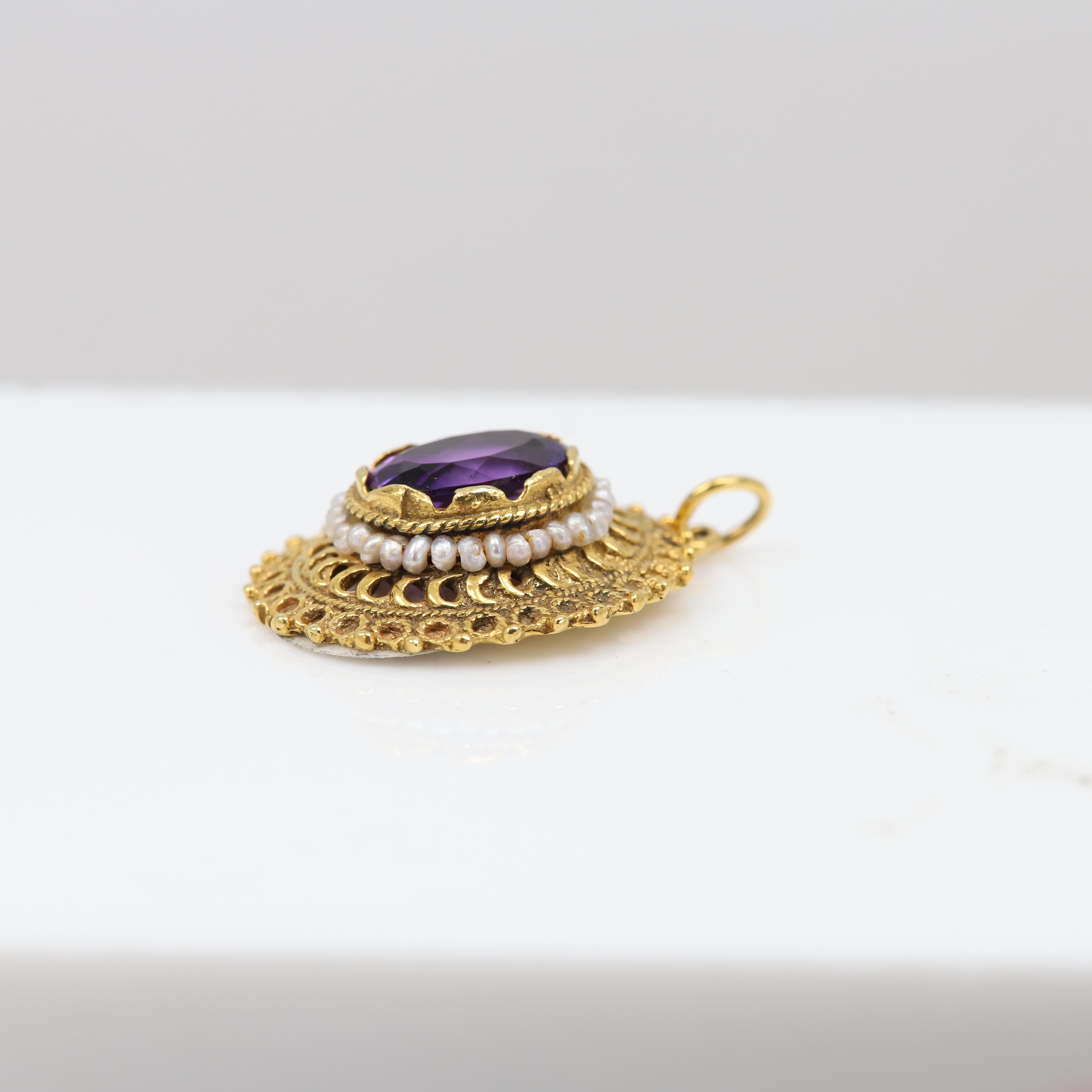 An old antique pendant made with 
a brilliant oval amethyst.
the hand made craft workmanship style is clearly visible in this pendant 
with the beautiful art work around the stone.
Pendant size: approx. 23 x 20 mm
Stone size: 12 x 10 mm
Weight: 4.20