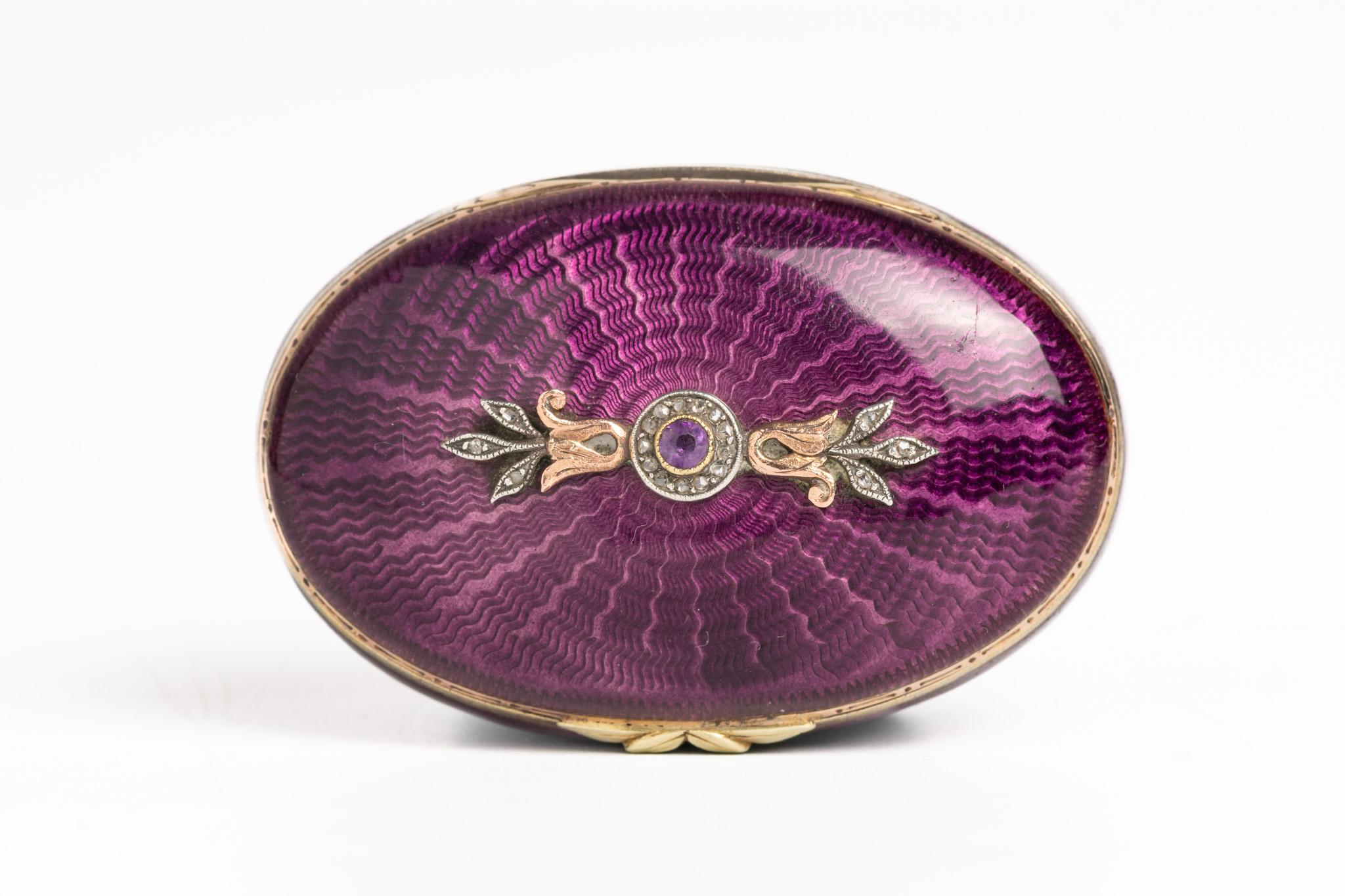 This very rare and magnificent purple guilloché enamel and silver gilt pill box is dated circa the 1920s. It's the finest guilloche enamel box we've seen so far. We also believe the origins are Austrian or French. This extraordinary piece represents