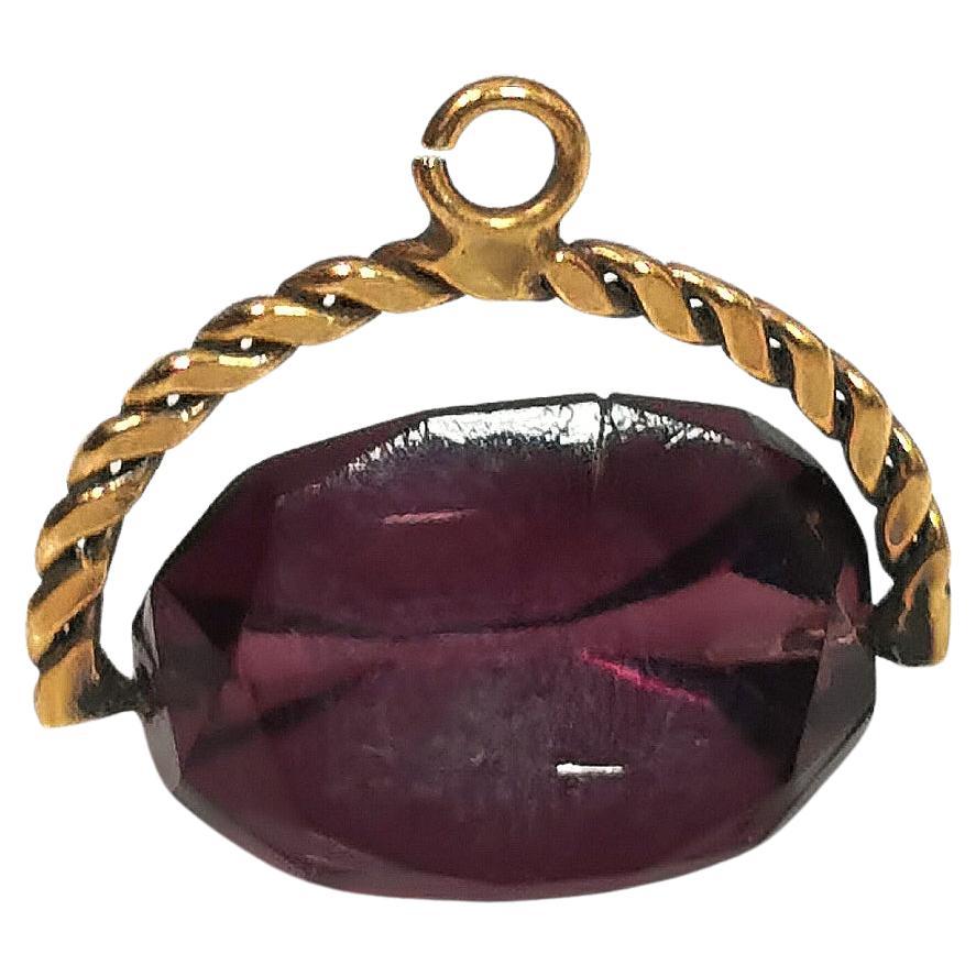 Antique purple paste spinning fob, gold plated