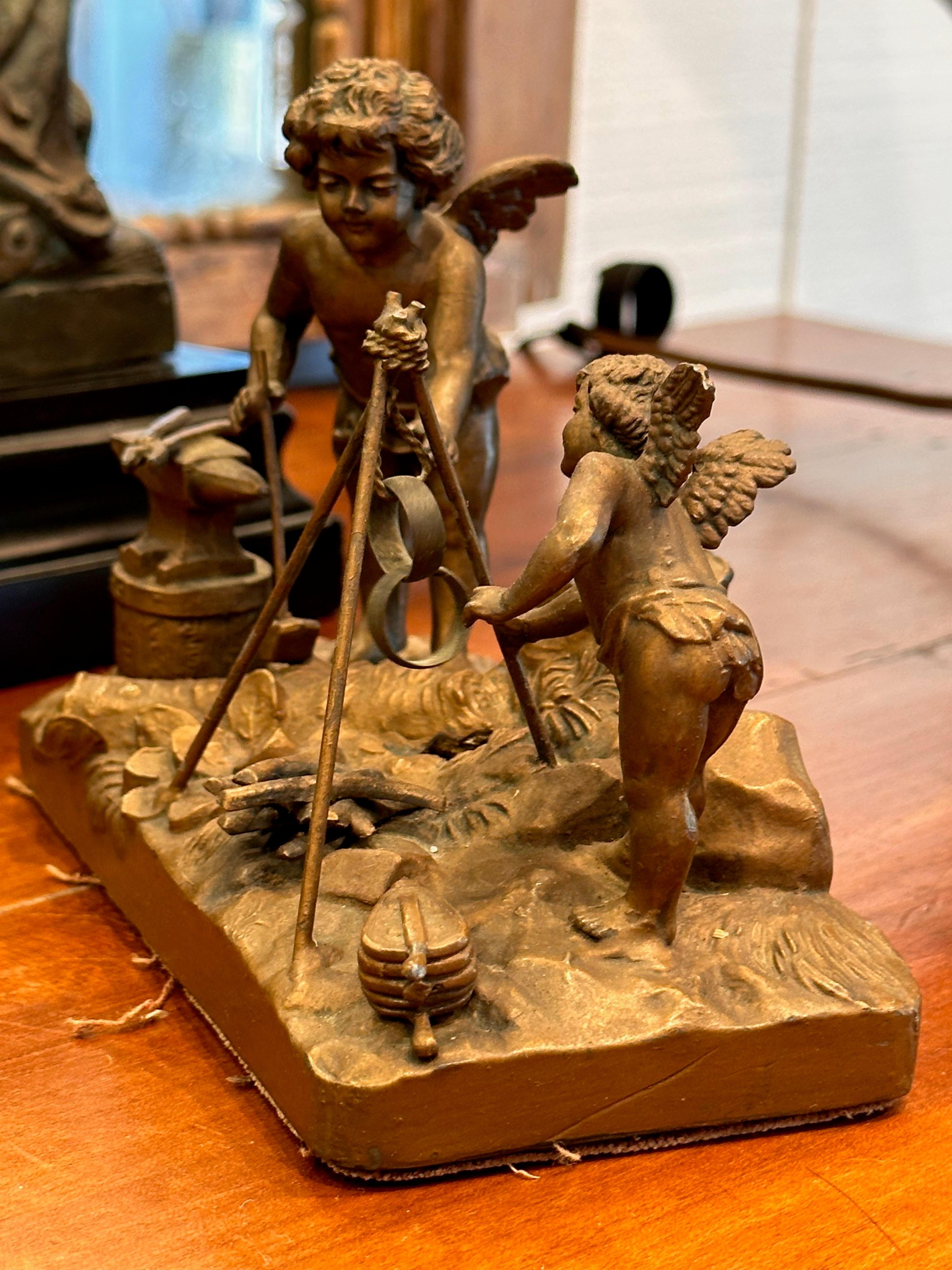 French Antique Putti at the Fire Sculpture For Sale