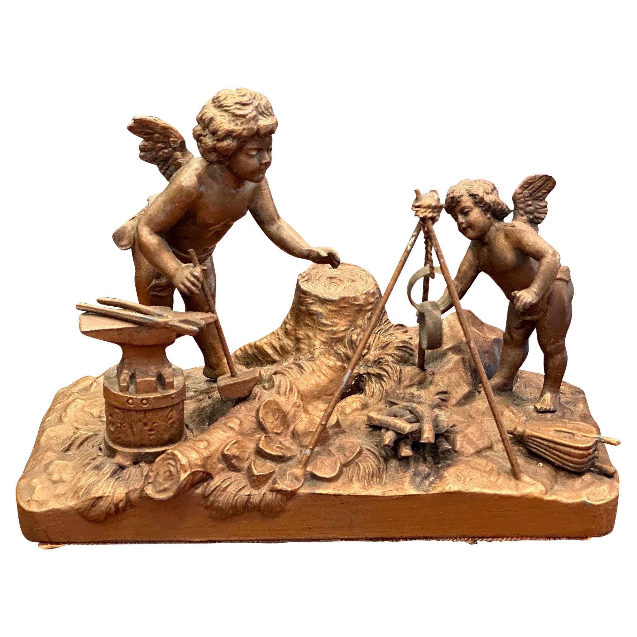 Antique Putti at the Fire Sculpture For Sale