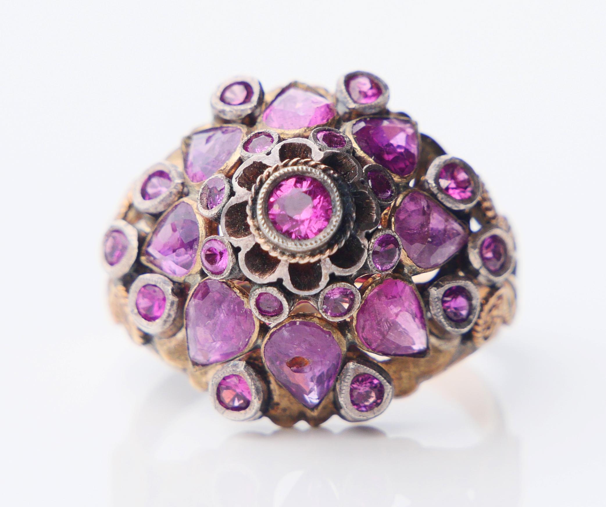 Antique Ring with pyramid / dome shaped openwork crown in 14K Yellow and White Gold decorated with 27 natural pink Rubies.

Likely European made in 1920s- 1930s. Hallmarked 14K. 

Crown is Ø 18mm and 13.5 mm high.
Stones from top  > down : central