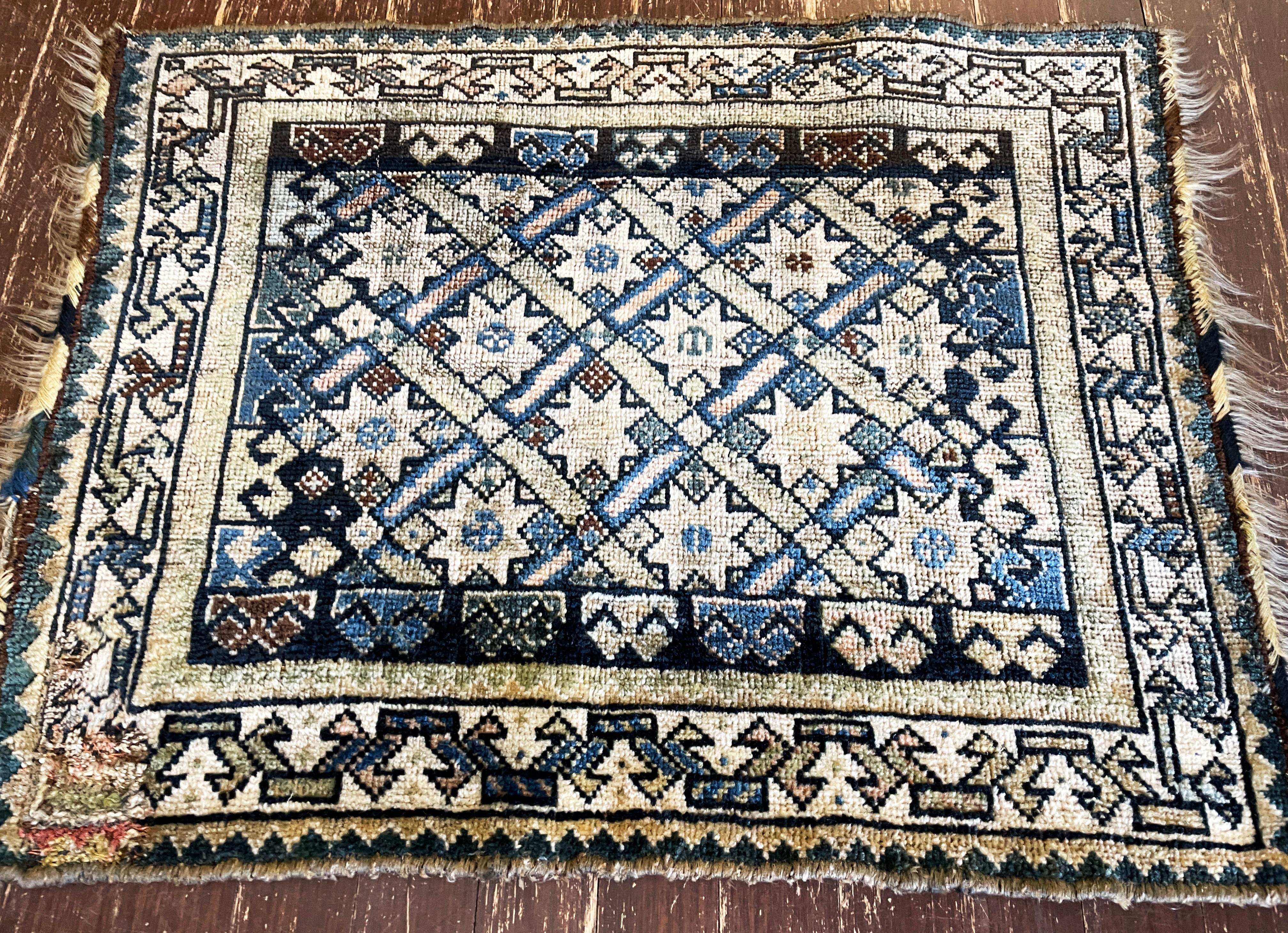 
Antique Qashqai rugs and bags are highly prized for their vibrant colors, intricate designs, and exceptional craftsmanship. Originating from the Qashqai people, a nomadic group in southwestern Iran, these textiles reflect a rich cultural heritage