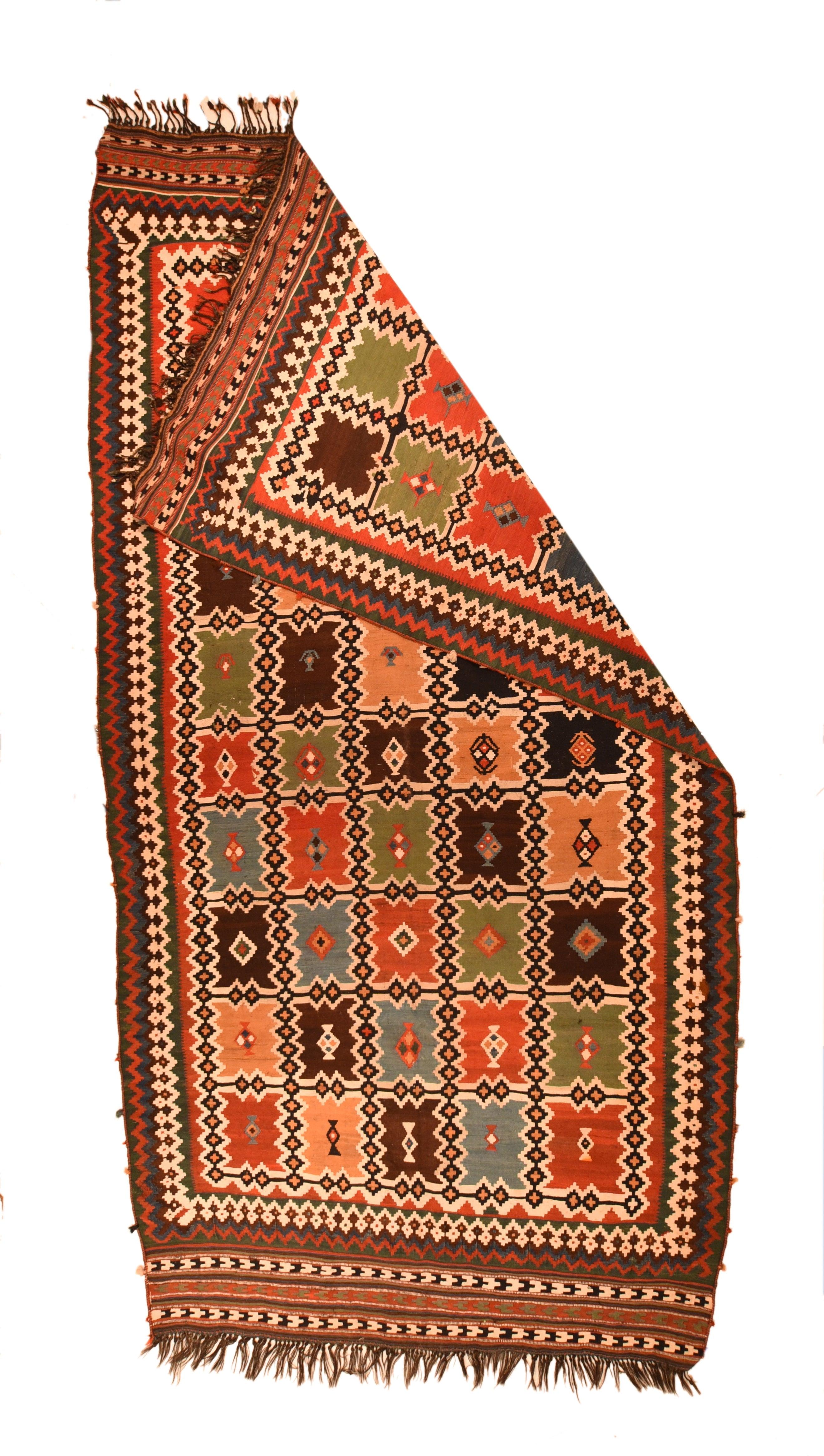 Antique Qashqai Kilim Rug 5'7'' x 10'9''. A five by ten matrix of notched panels on an ecru ground is defined by an orthogonal trellis of diamond chains. The panels are in: green, teal, royal blue, straw, red, rust-red, and create color diagonals.