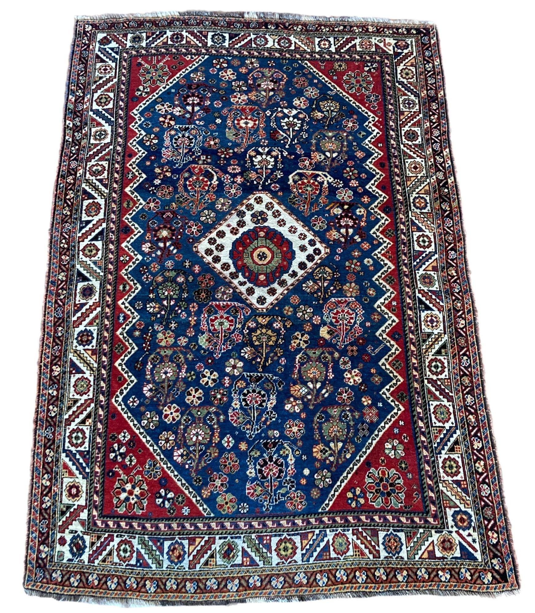 A stunning antique tribal rug, hand woven by the Qashqai tribe circa 1910. The design features a small geometrical medallion on a mid indigo field of Botehs. Very finely woven with exceptional quality wool and stunning colours
Size: 1.86m x 1.27m
