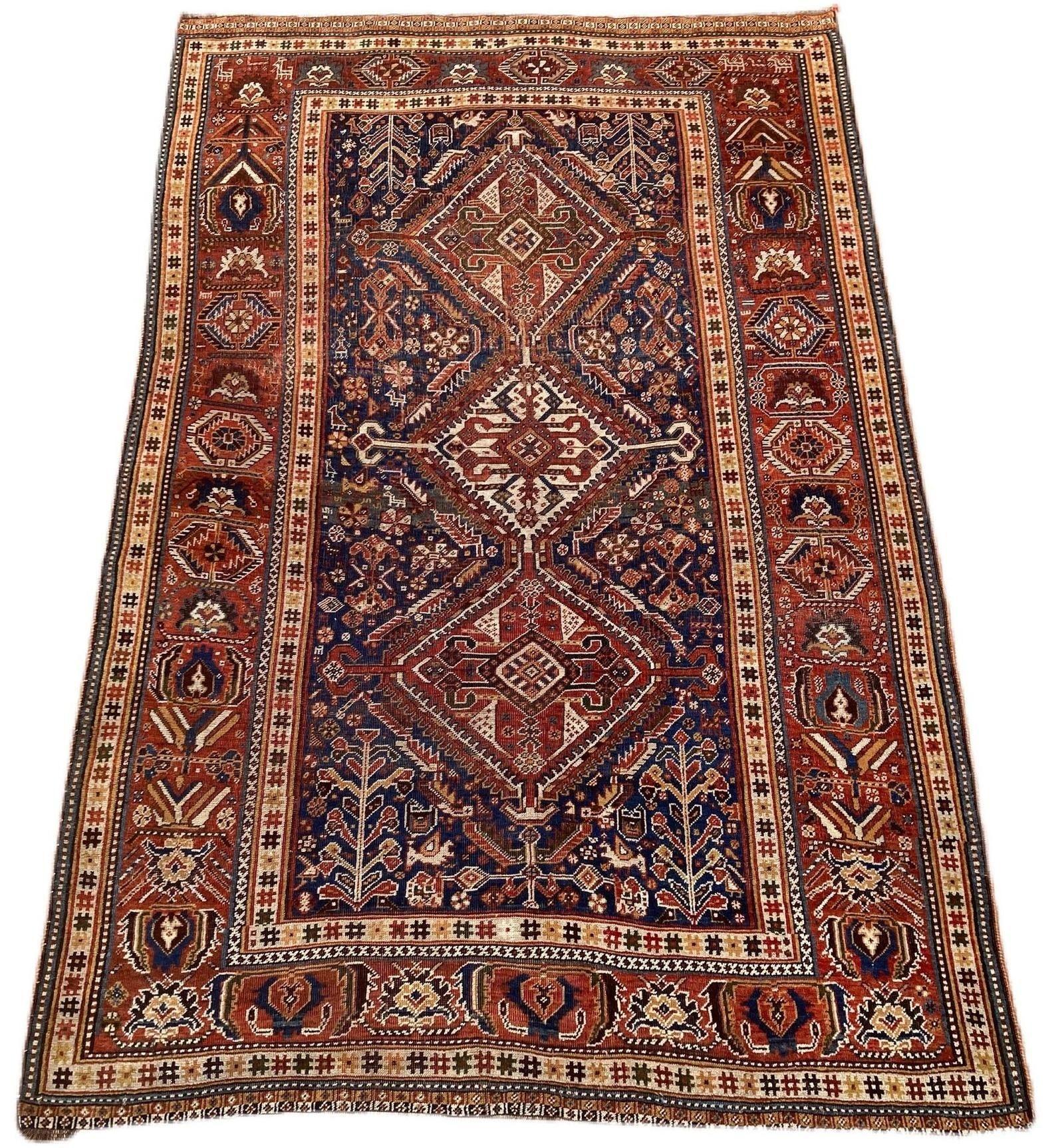 A fabulous antique Qashqai rug, handwoven by the eponymous nomadic tribe circa 1900 with a geometrical 3 medallion design on an indigo field and great secondary colours. Note the small figures throughout the field (see photos).
Size: 2.36m x 1.60m