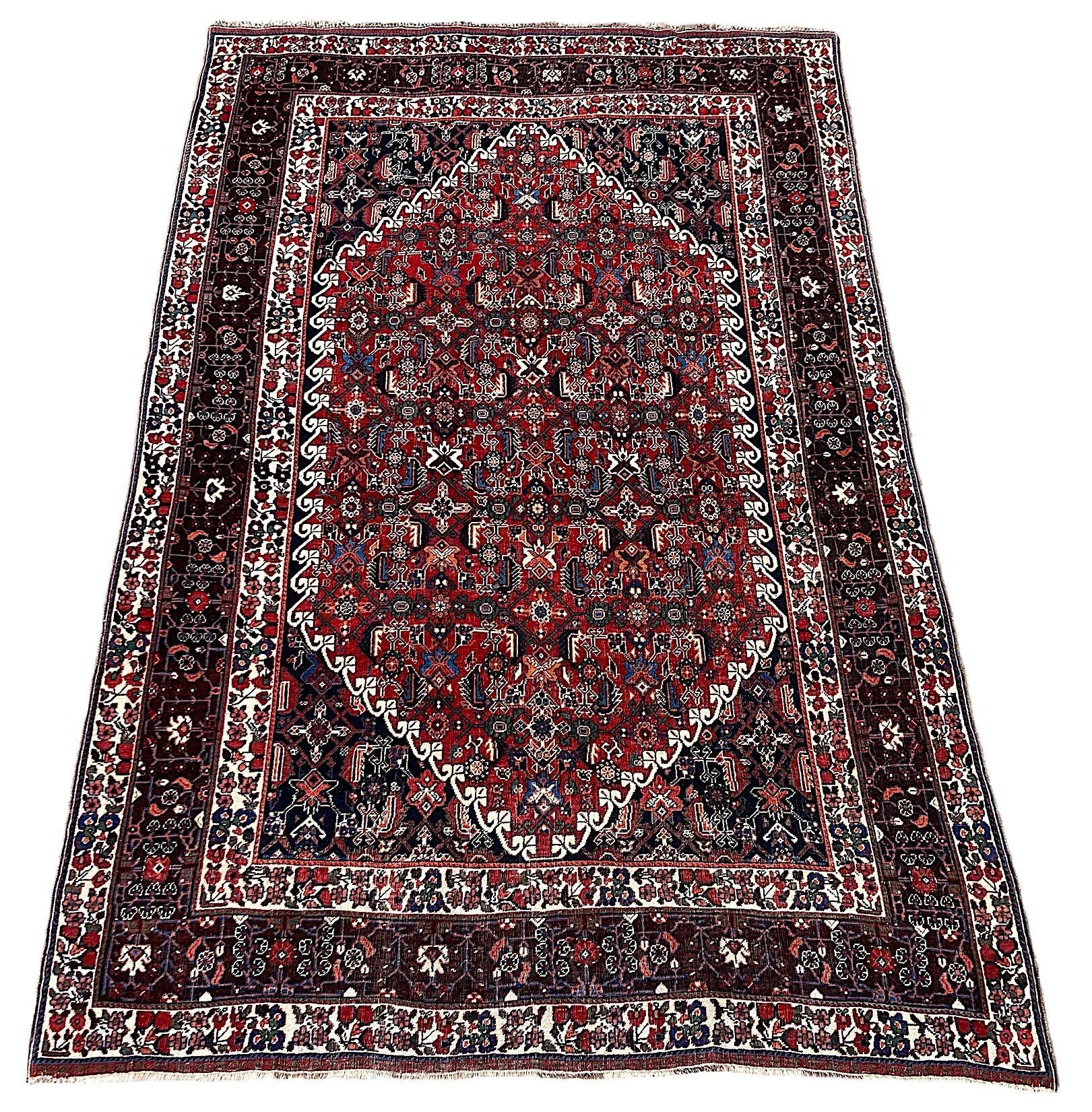 A lovely antique Qashqai rug, handwoven by the eponymous nomadic tribe circa 1910. The rug features an allover design on a rich terracotta field and great secondary colours of greens, pinks and blues. Finely woven and a great example of tribal