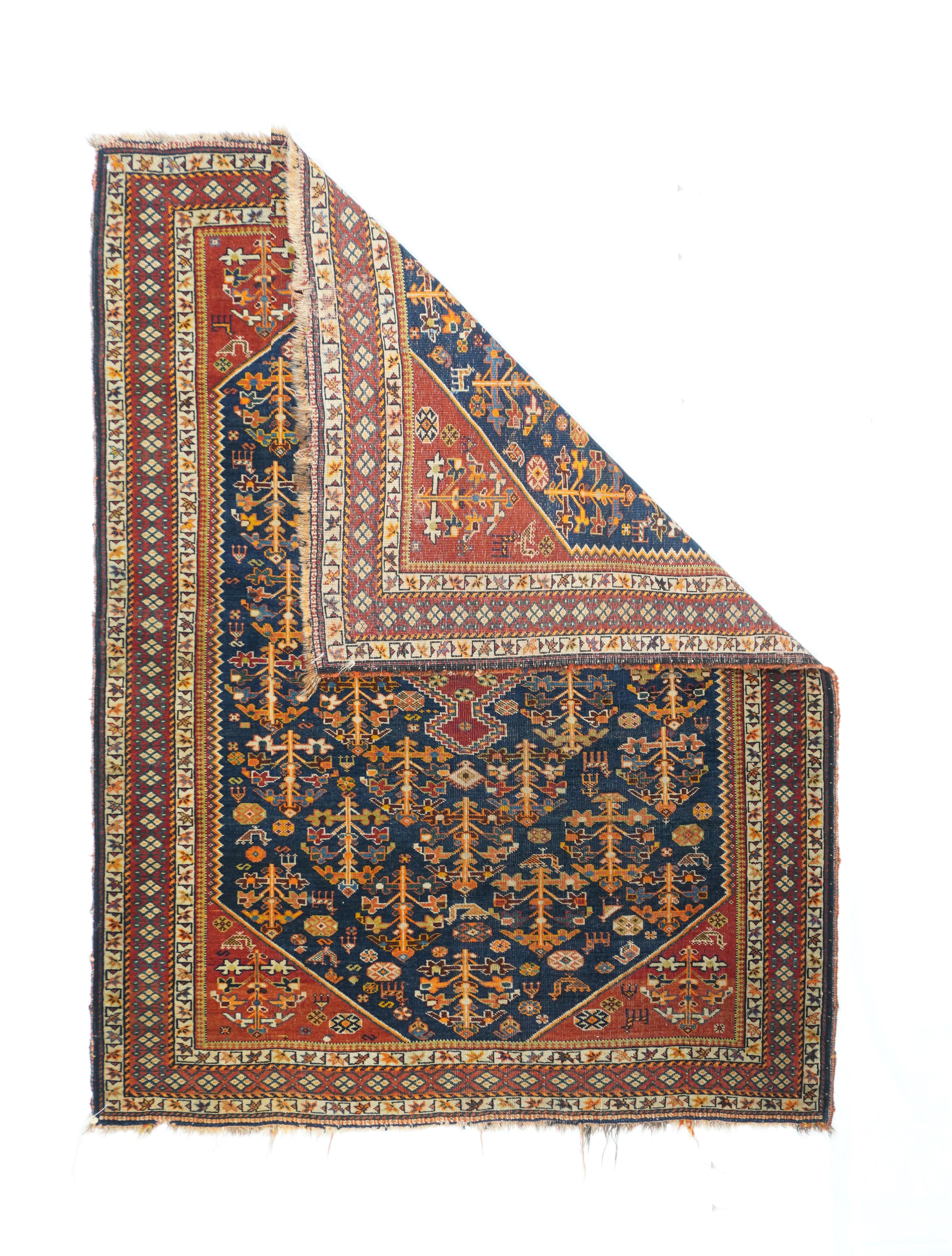 Antique Qashqai Rug. The dark blue subfield shows a zig-zag edge and an allover, unidirectional display of animals and stylized flowers, all supporting a closely pendanted stepped, red lozengoid medallion. Red corners with more flowers and little