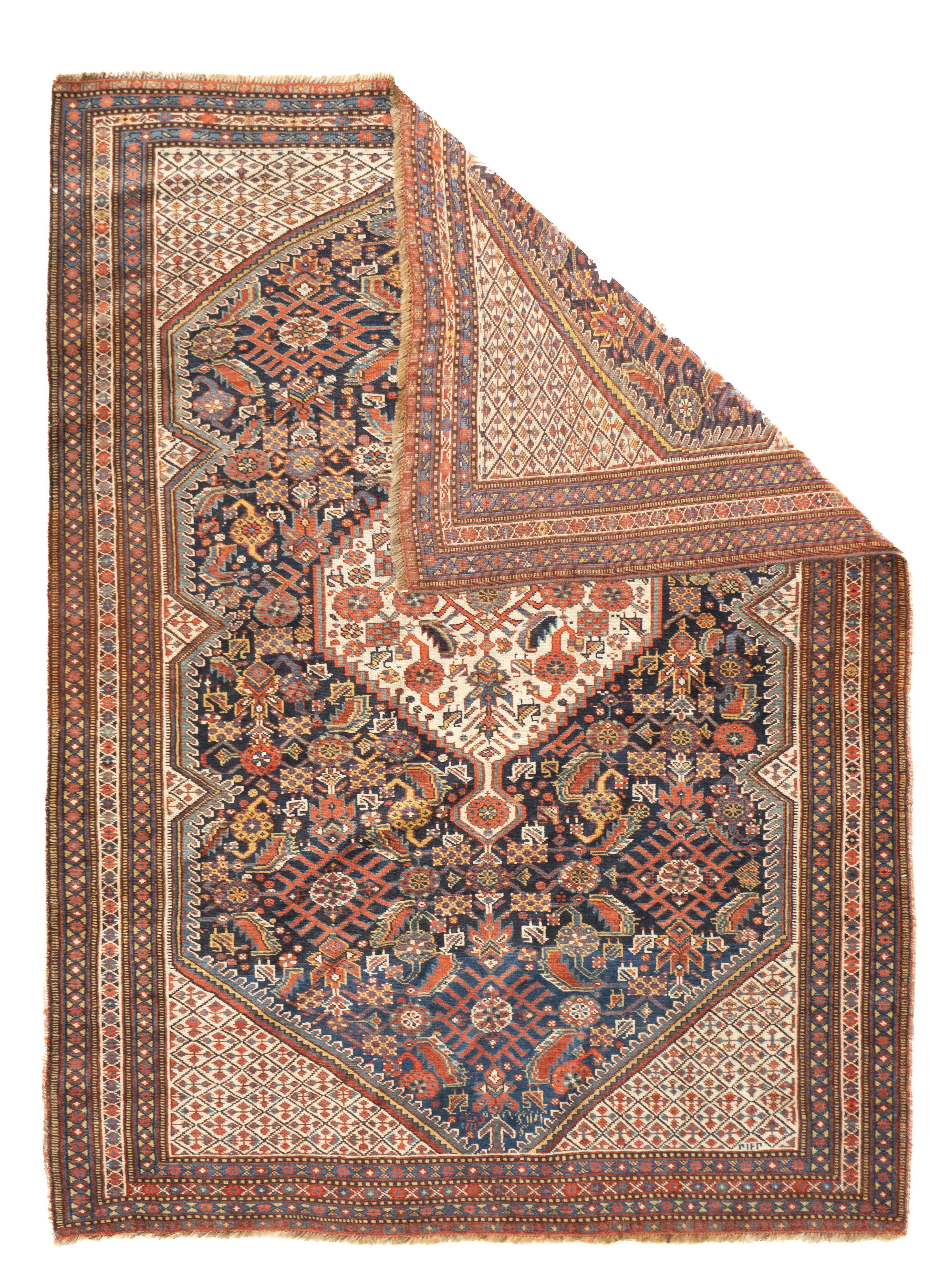 Antique Qashqai Rug 4'7'' x 6'3''. The dark blue Herati-pattern sub- field of this SW Persian tribal scatter hosts a similar-pattern stepped hexagonal medallion, while the cream field expands at the corner triangles and show a small repeating