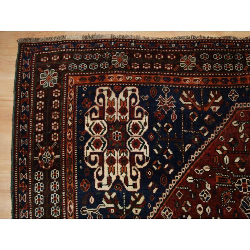 A good Antique Qashqai rug, with classic medallion design and superb colour.

A good Qashqai rug with excellent wool and superb colour. The design is one of the most classic of all Qashqai designs, note the horses heads on the pillars at the sides.