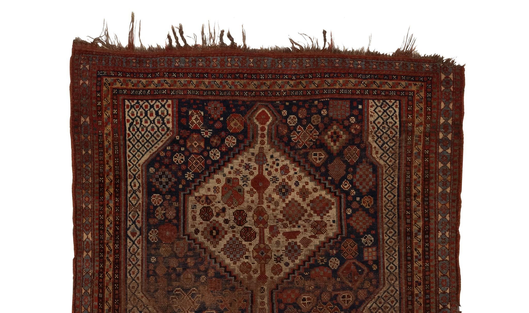 The Qashqai rugs are a testament to the rich cultural heritage and unifying spirit of a proud tribal confederation. These pastoral nomads, who trace their lineage to the Turkmen and Ersari tribes, traverse the vast expanse of the Isfahan province,
