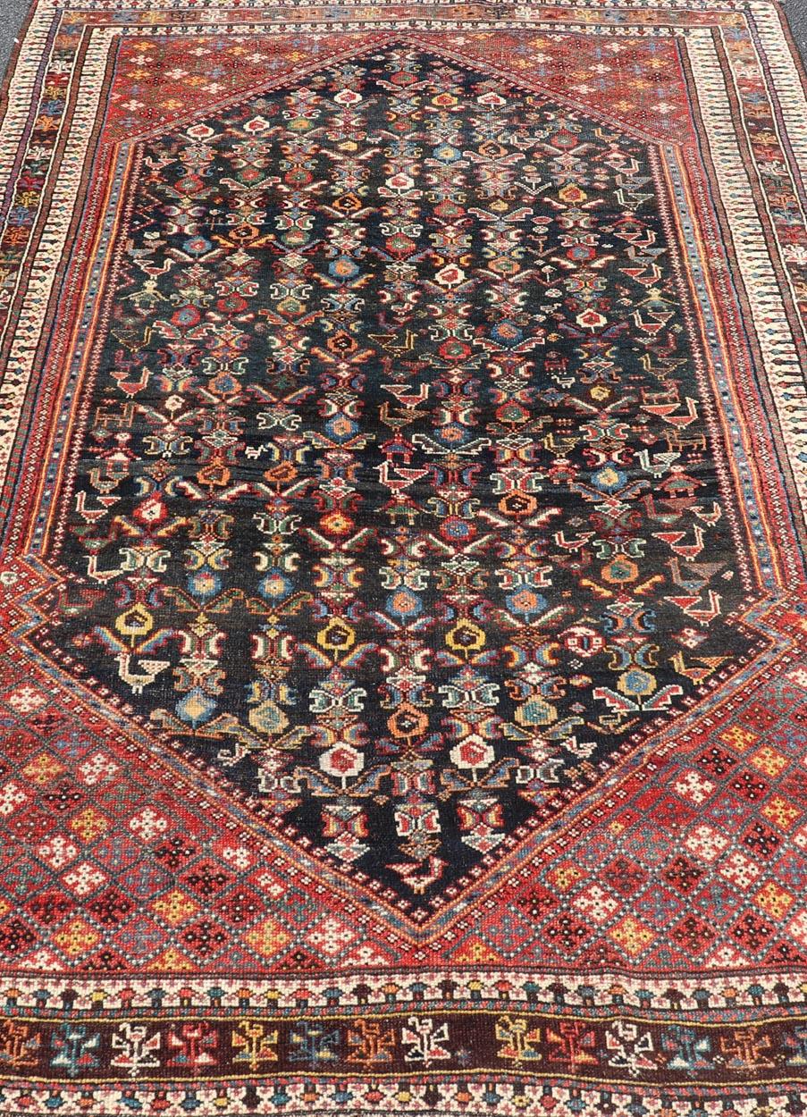 Measures: 5'7 x 8'10 
Antique Qashqai Tribal Rug With Medallion in Blue and Red 5'7 x 8'10
Keivan Woven Arts/ rug/EMB-22245, country of origin / type: Iran / Qashqai, circa 1900. 

This Qashgai rug has rich heritage and intricate design