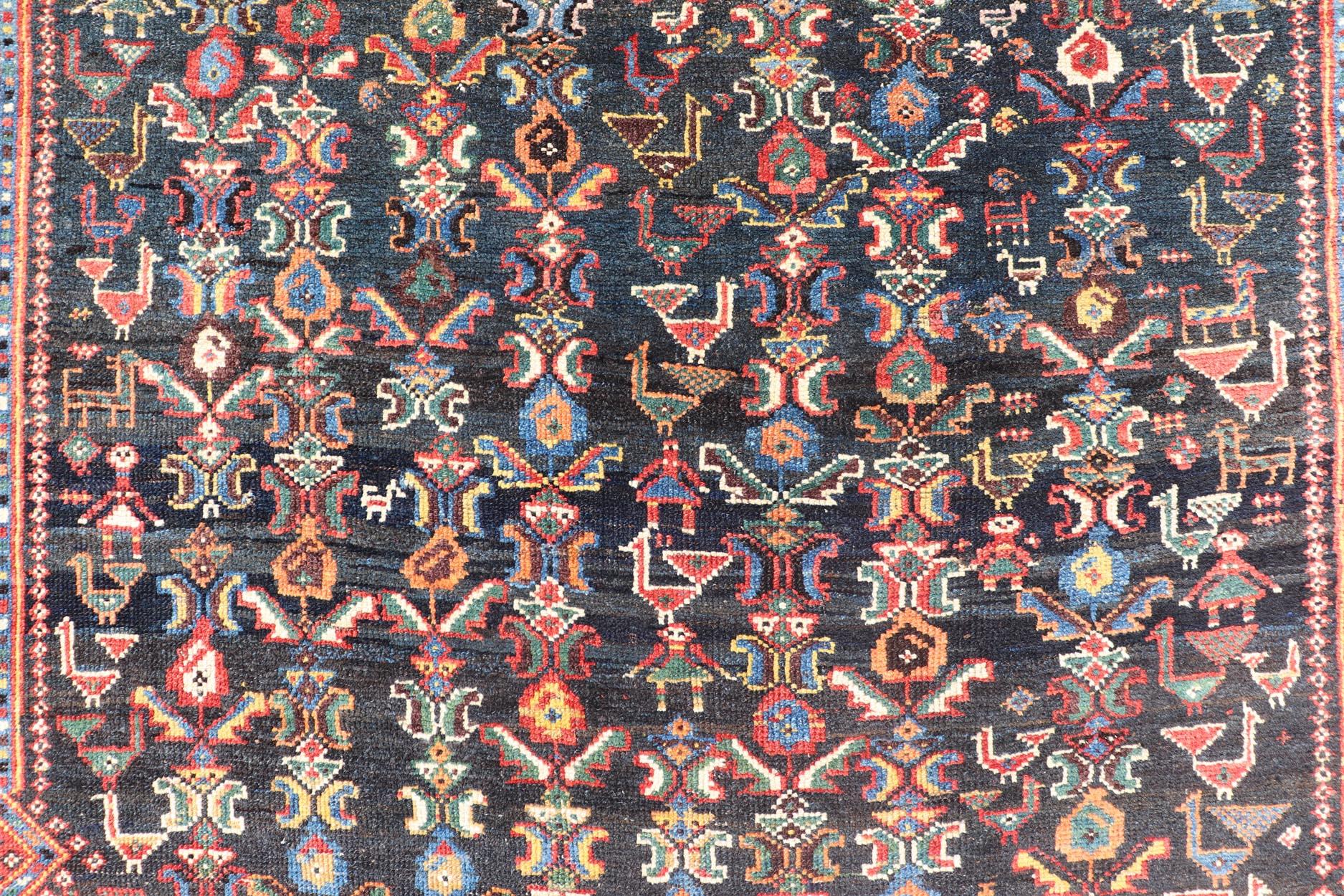 20th Century Antique Qashqai Tribal Rug With Medallion in Blue and Red 5'7 x 8'10 For Sale