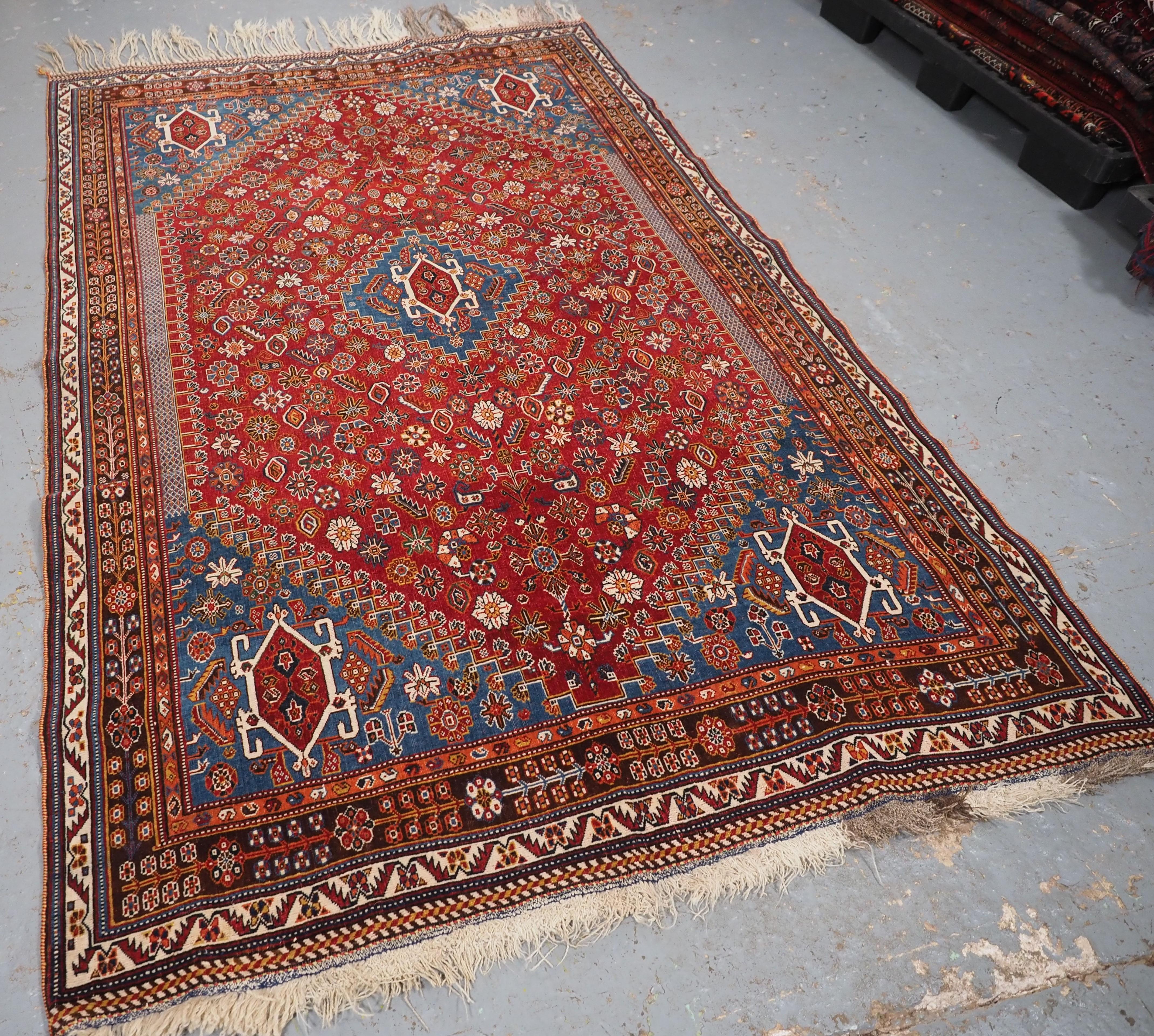Size: 7ft 9in x 4ft 11in (237 x 149cm).

Antique Qashqai tribal rug with small central medallion.

Circa 1890.

An outstanding Qashqai tribal rug with a small central medallion of a clear madder red field. The rug is covered with floral rosettes and