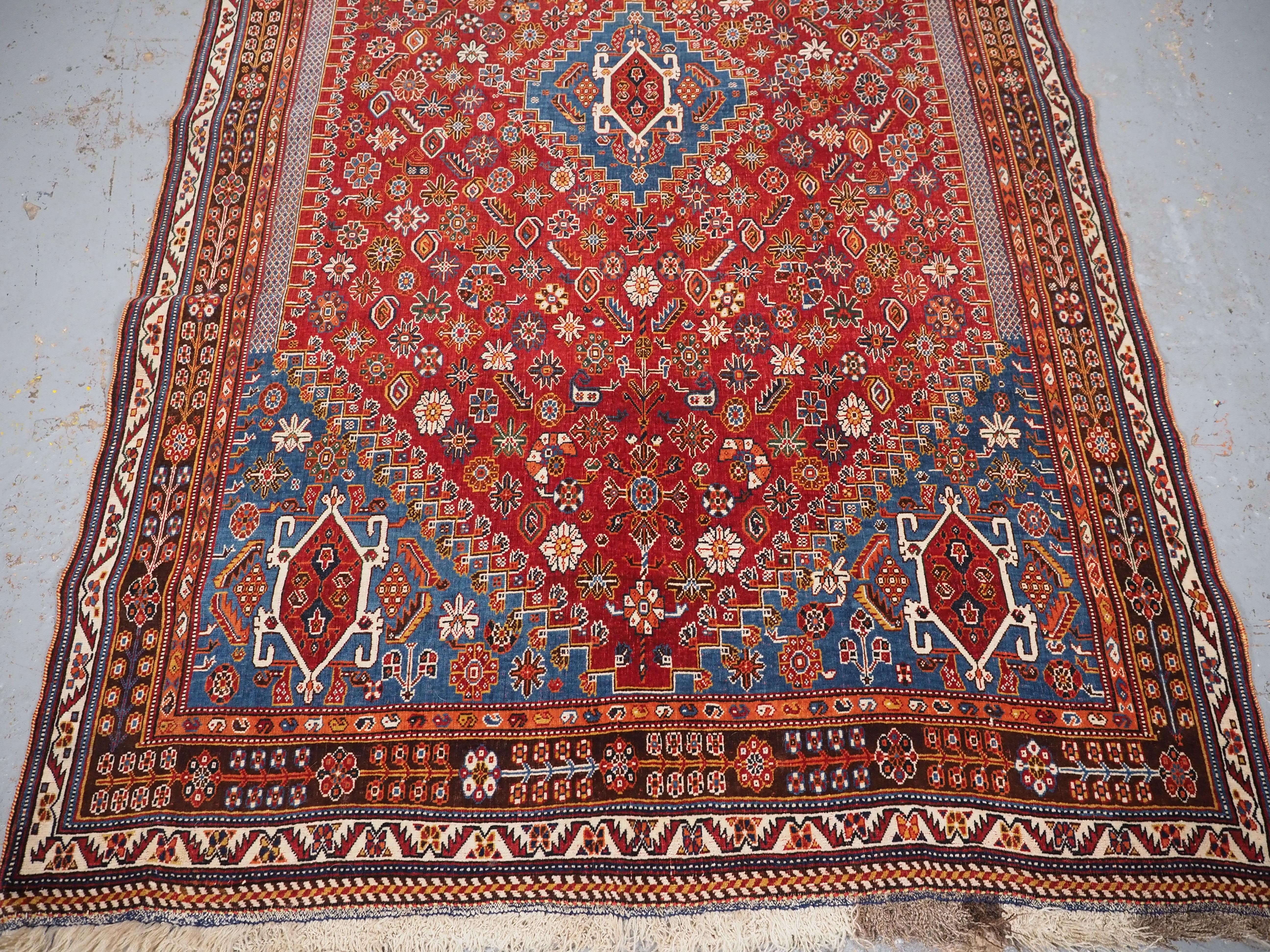 Late 19th Century Antique Qashqai tribal rug with small central medallion.  Circa 1890. For Sale