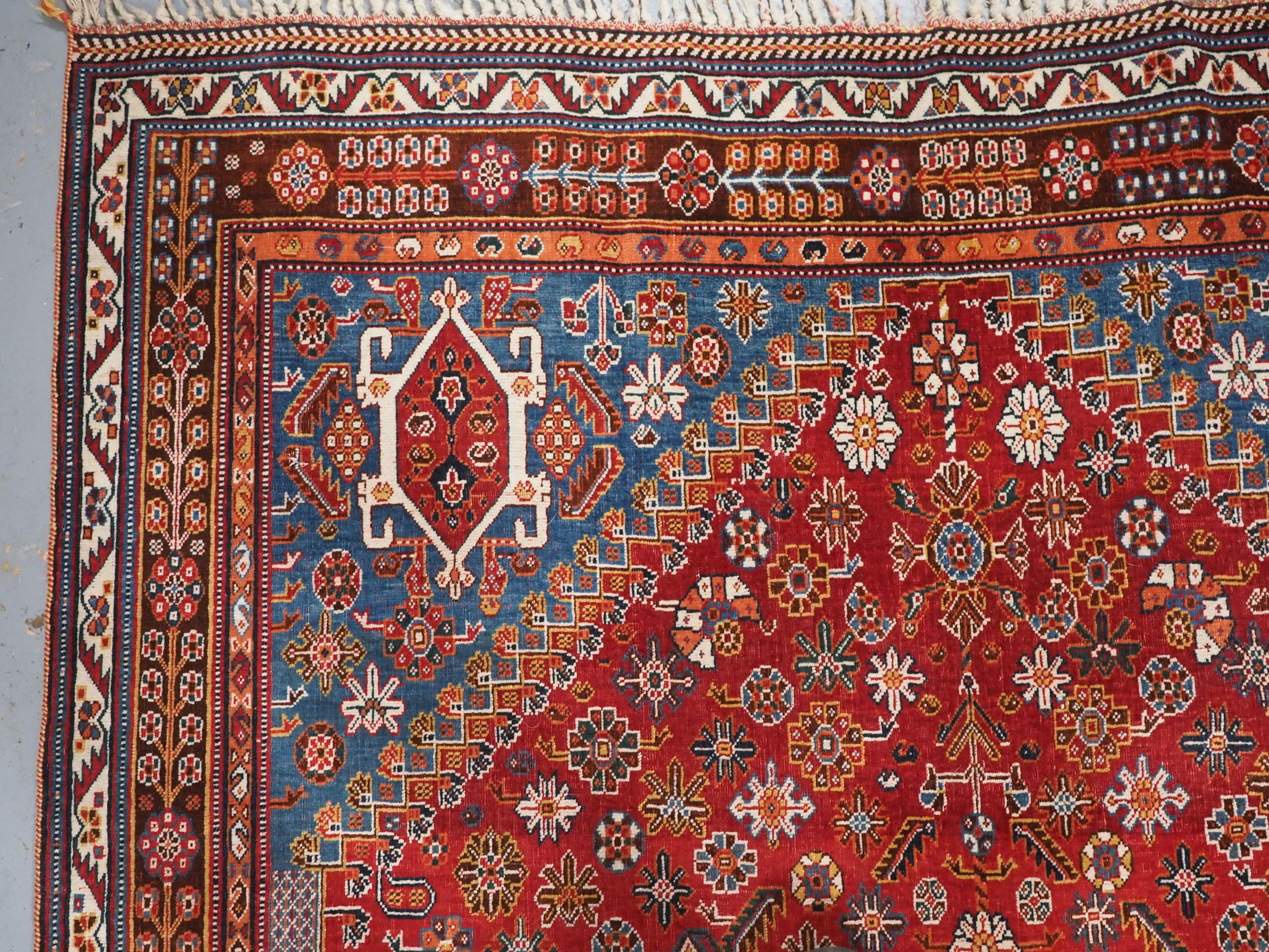 Wool Antique Qashqai tribal rug with small central medallion.  Circa 1890. For Sale