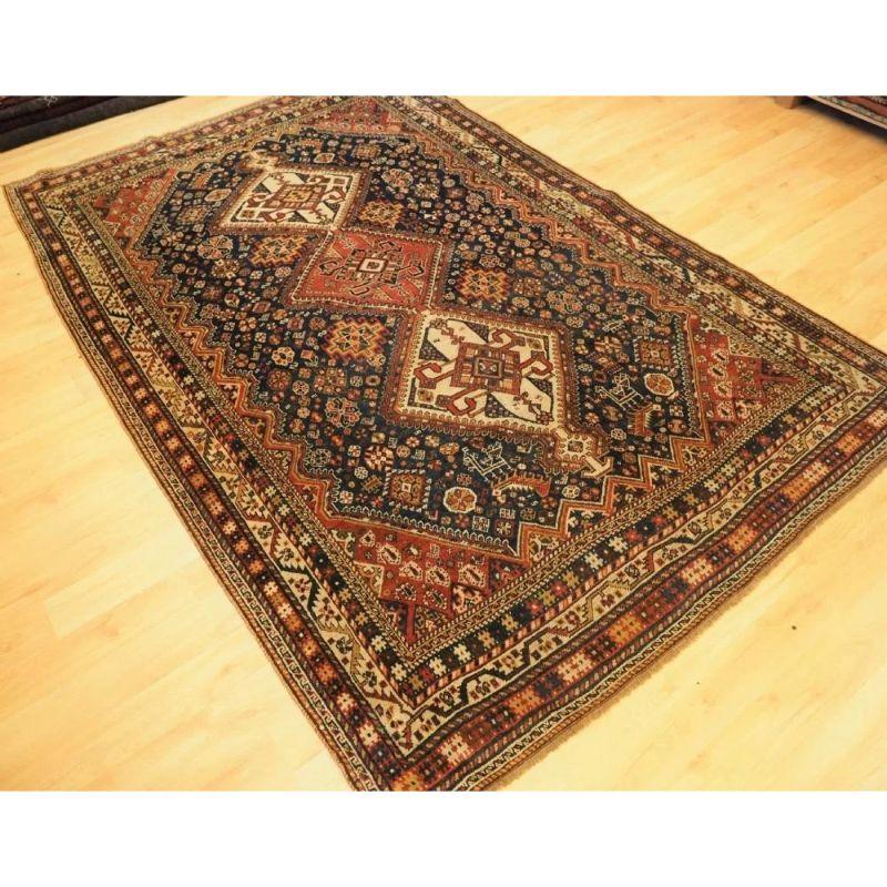 A classic Qashqai tribal rug with three medallions each containing a version of the Qashqai tribal emblem, the rug is covered with tribal design elements. There are many small animals, birds and flowers.

The rug is in excellent condition with