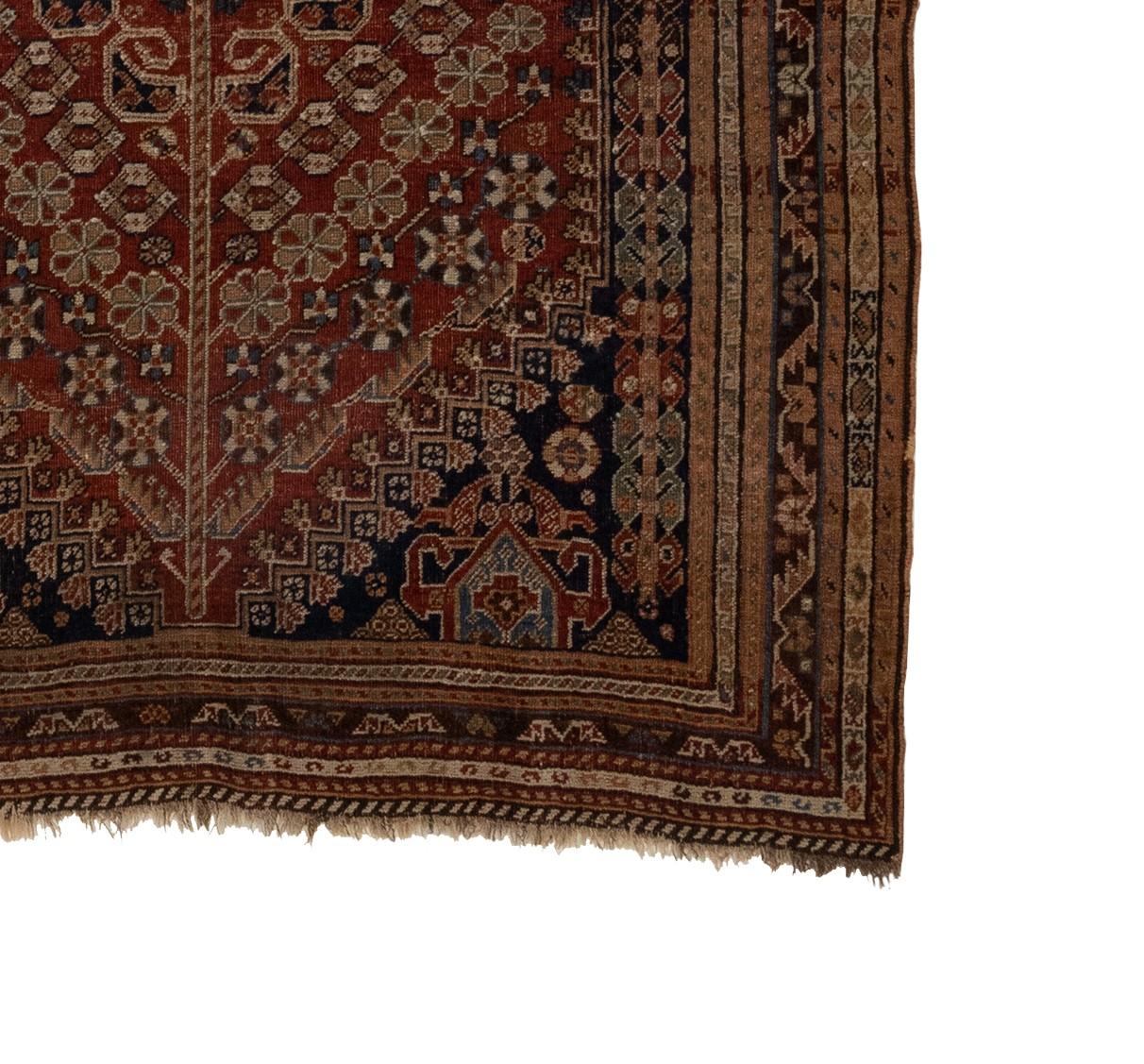 The Qashqai rugs are a testament to the rich cultural heritage and unifying spirit of a proud tribal confederation. These pastoral nomads, who trace their lineage to the Turkmen and Ersari tribes, traverse the vast expanse of the Isfahan province,